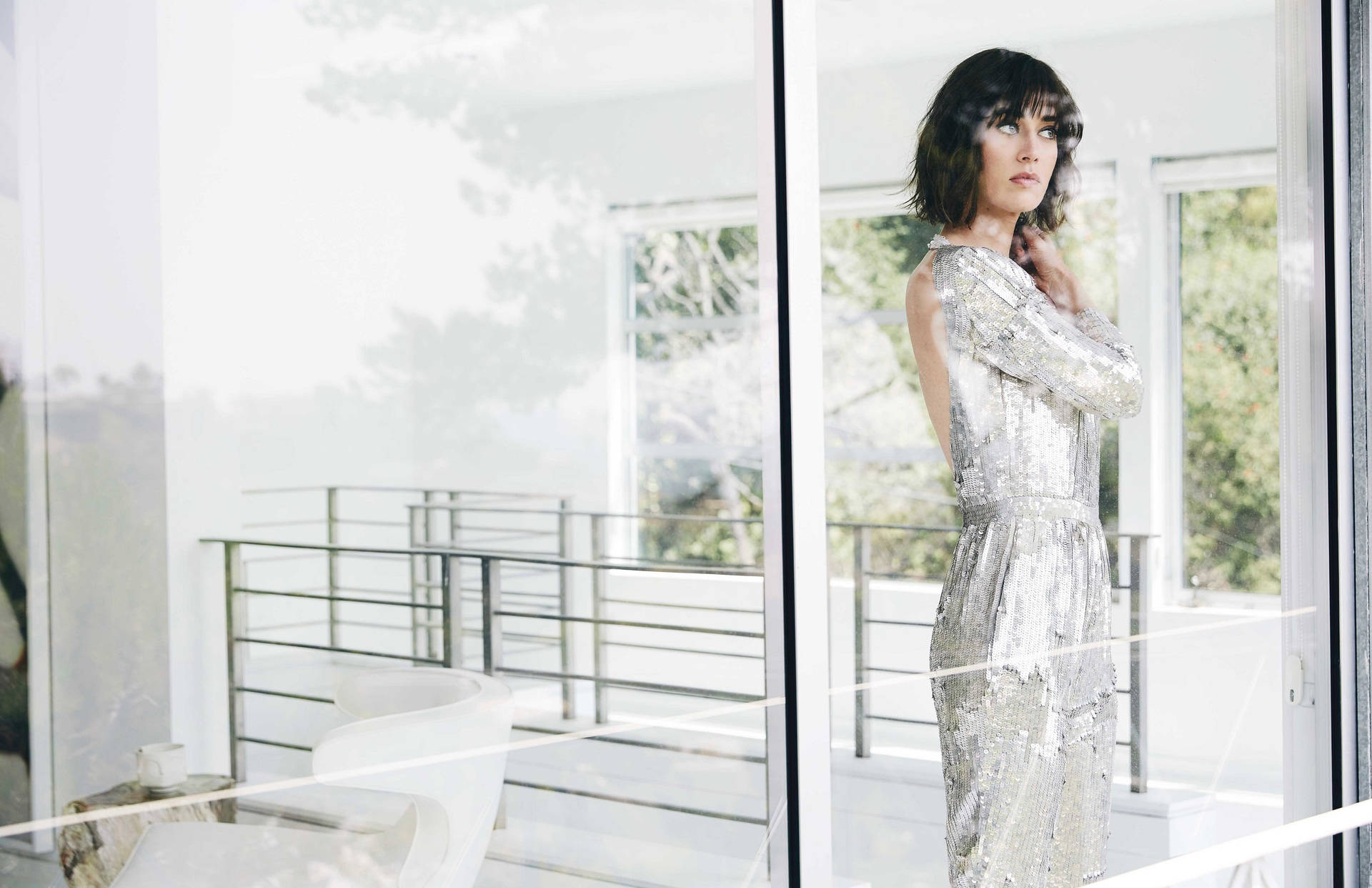 Lizzy Caplan By The Window Wallpaper