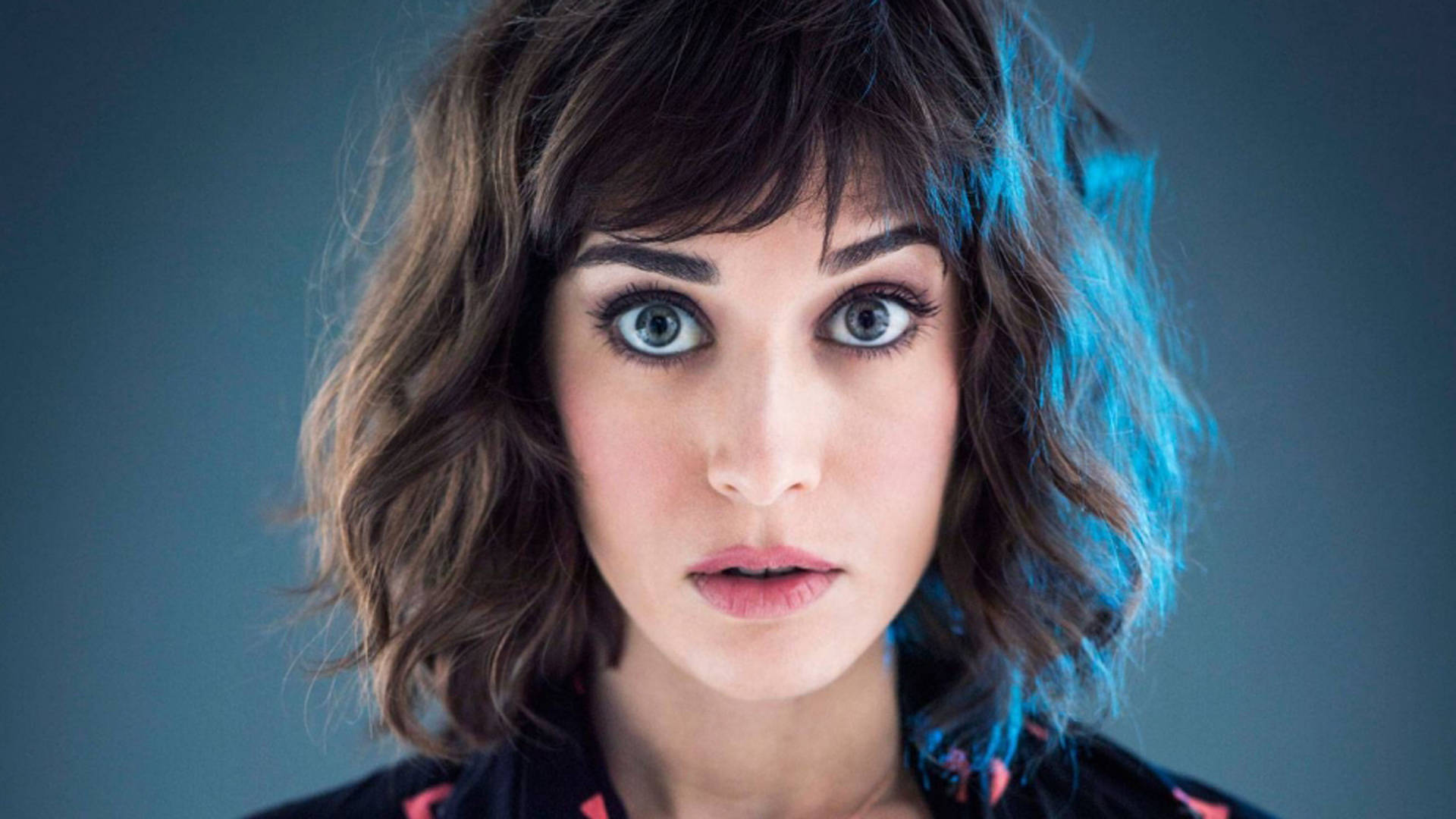 Lizzy Caplan With A Wide-eyed Look Wallpaper