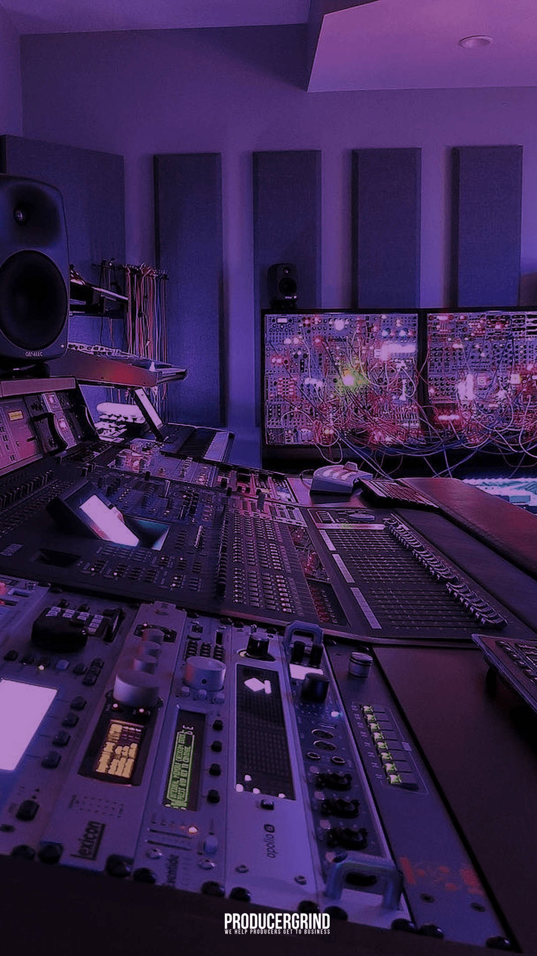 A Recording Studio With A Purple Light And Equipment Wallpaper