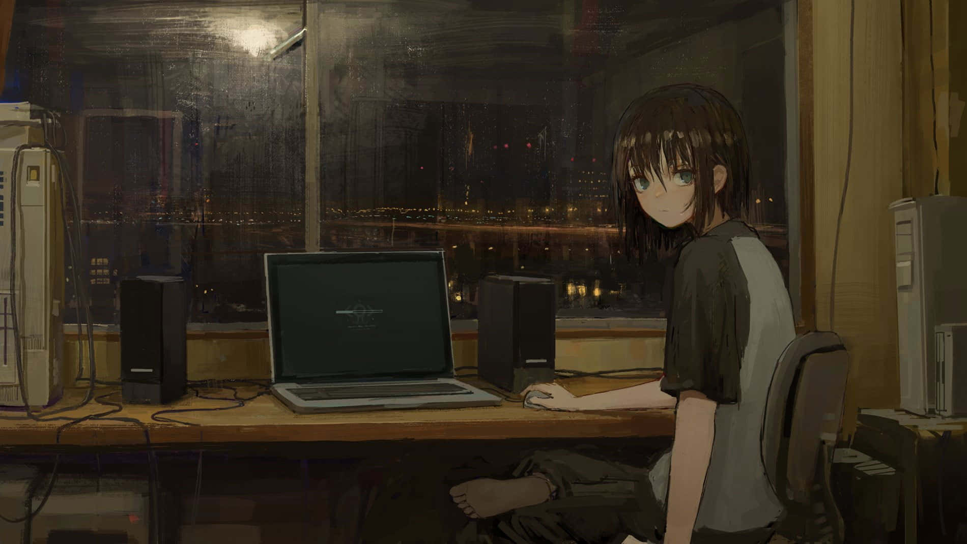 A Girl Sitting At A Desk With A Laptop Wallpaper
