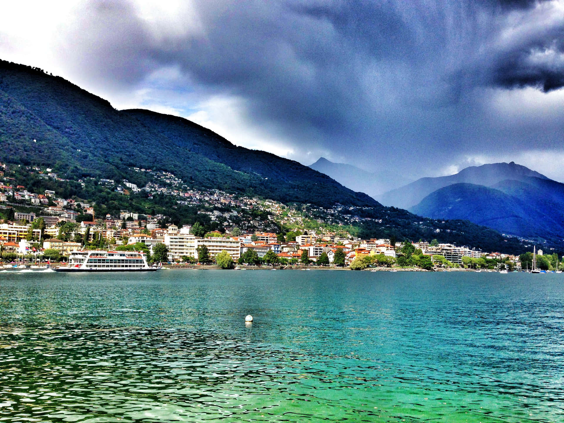 Download Locarno Lakefront Stormy Skies Wallpaper | Wallpapers.com