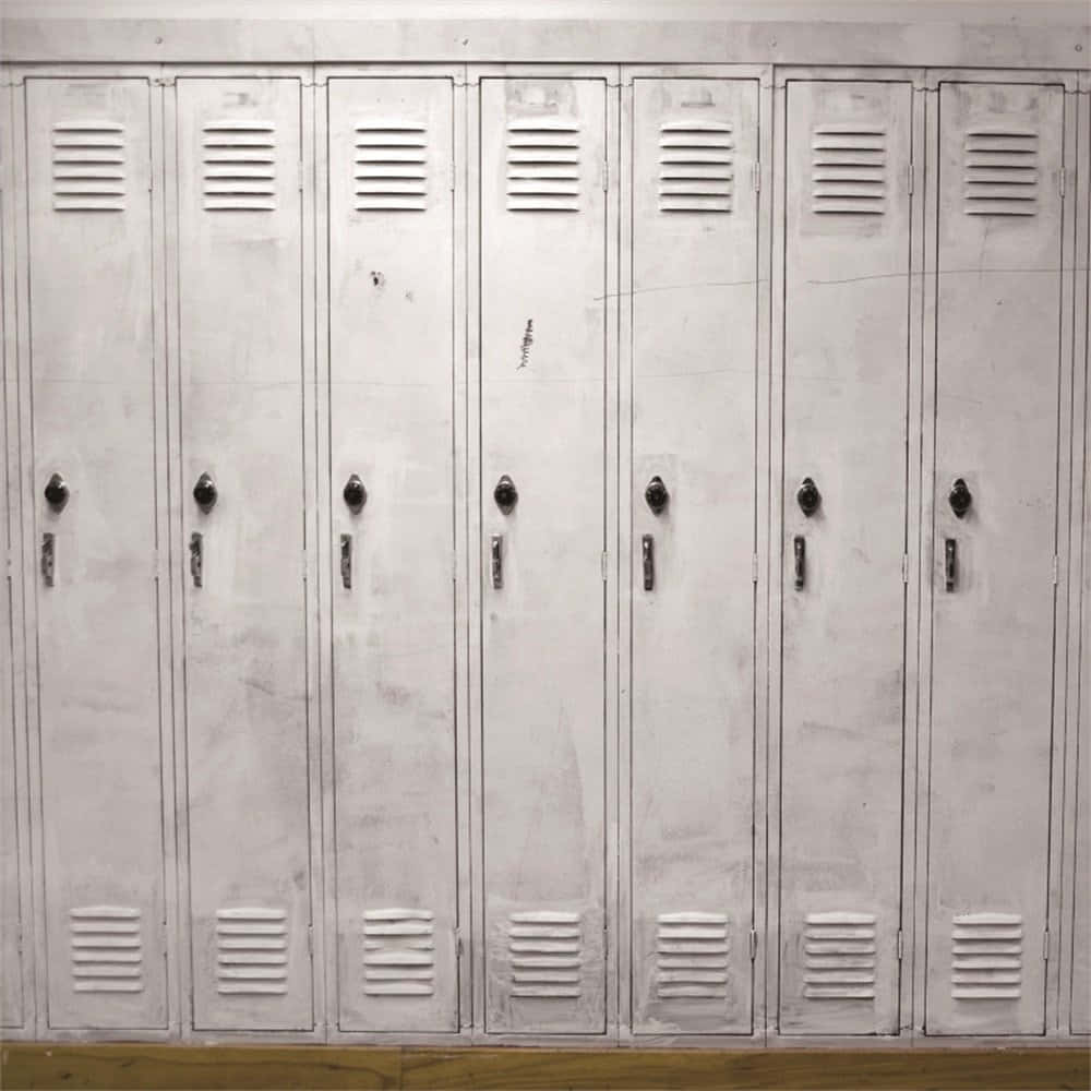 A Row Of White Lockers In A Room