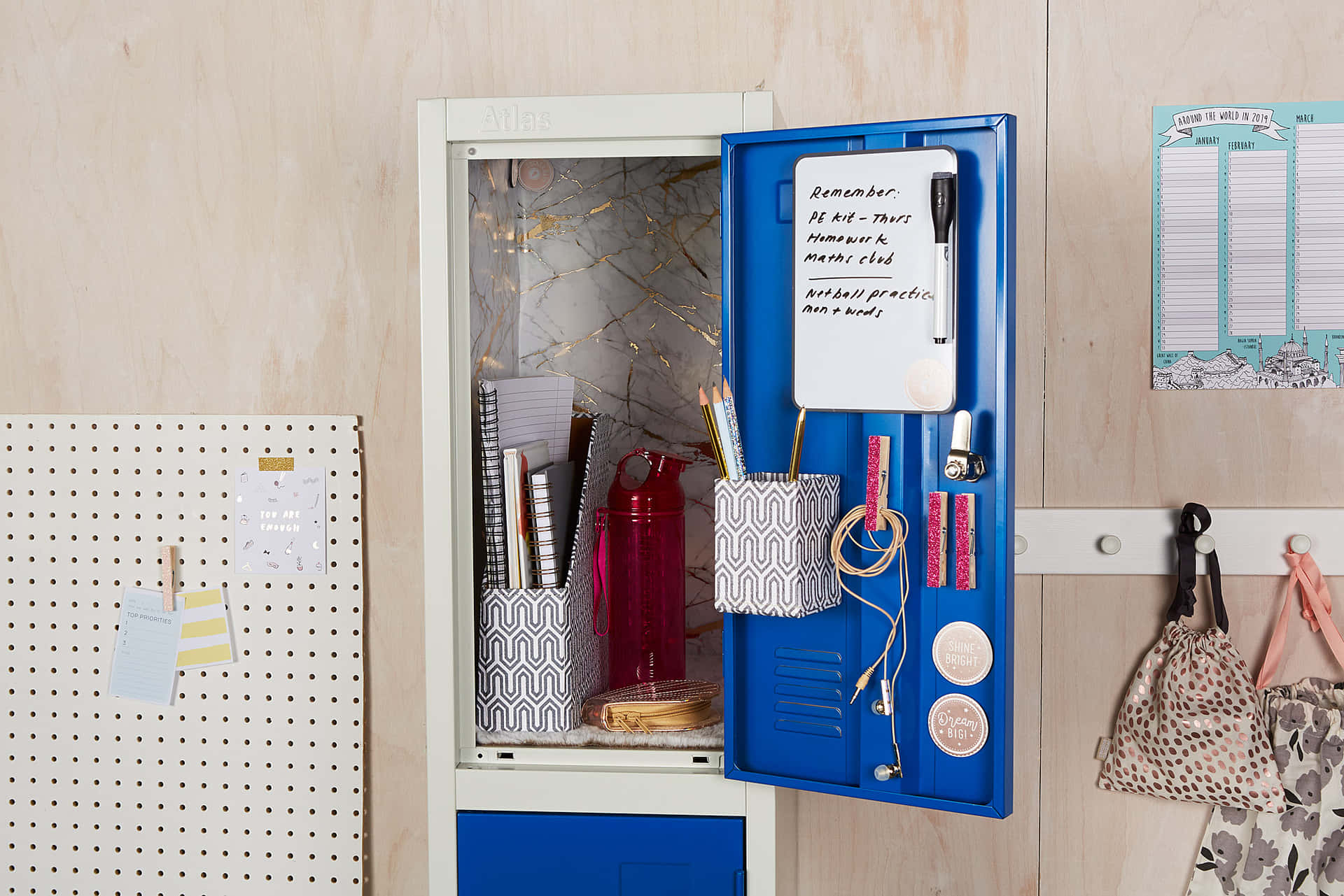A Blue Locker With A White Board And Pens