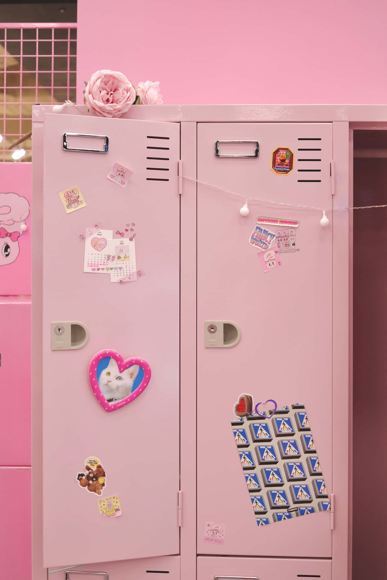 A Pink Locker With Stickers On It
