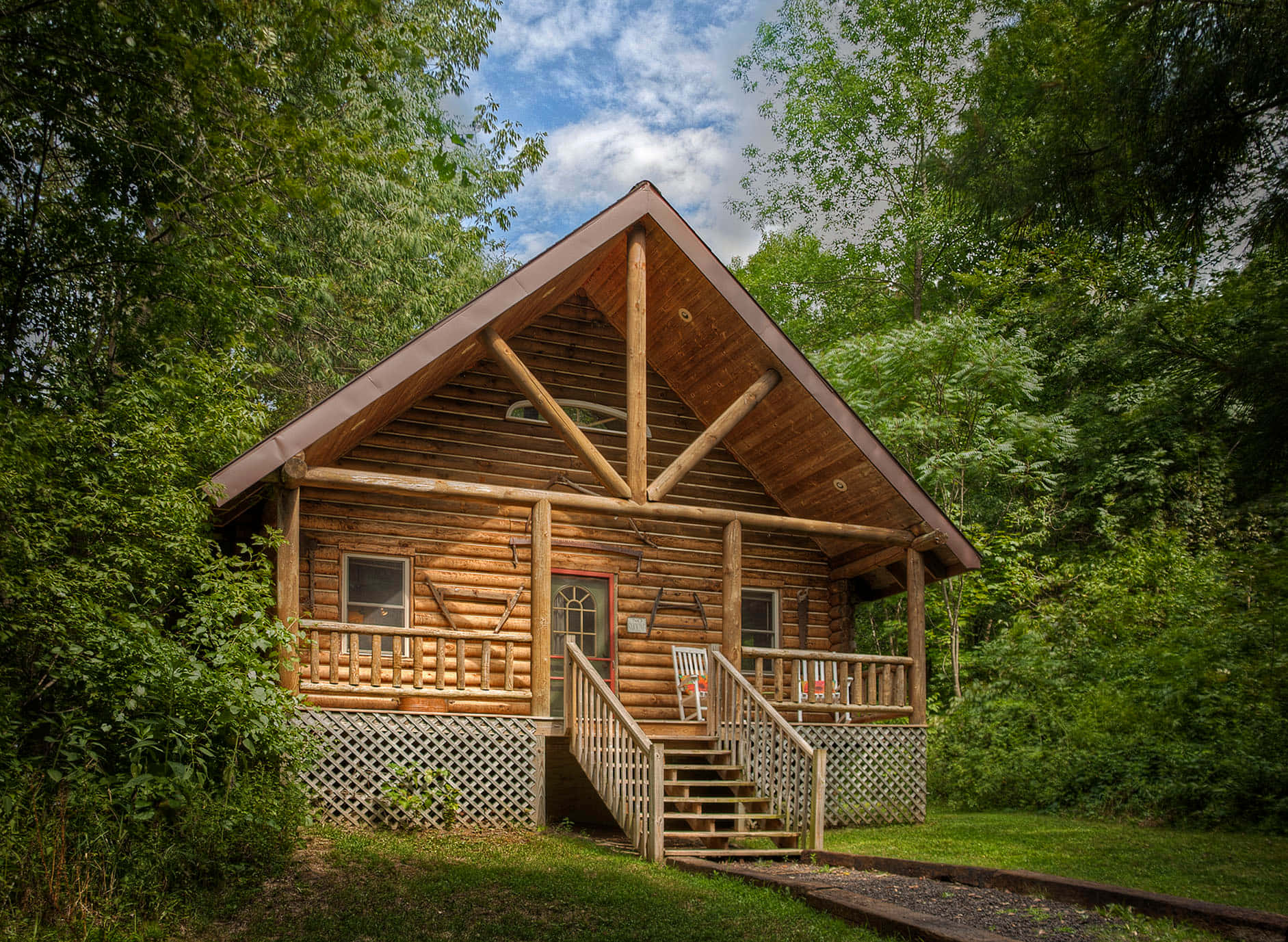 A log cabin tucked away in a picturesque mountain meadow