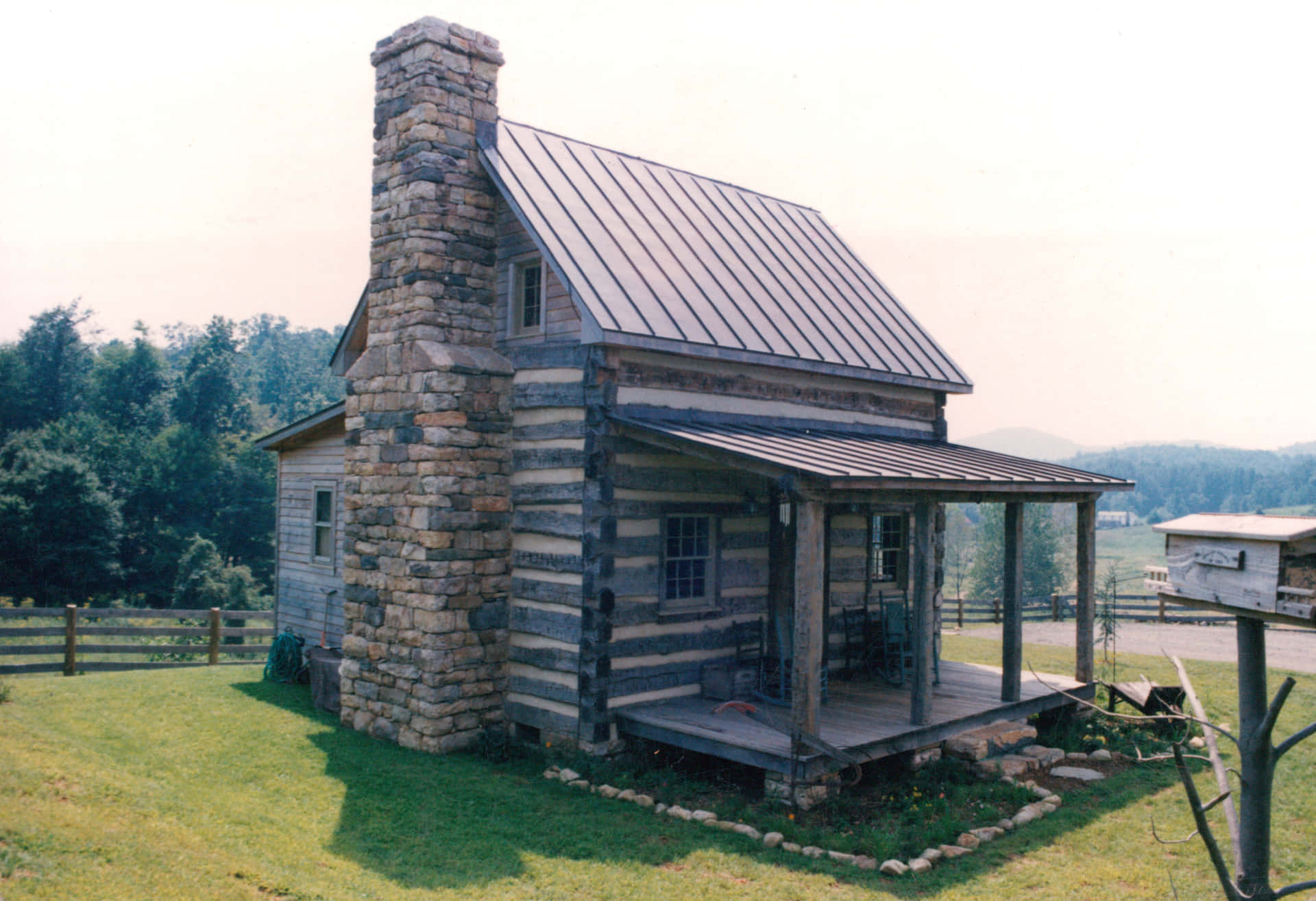 A rustic log cabin in a wooded area