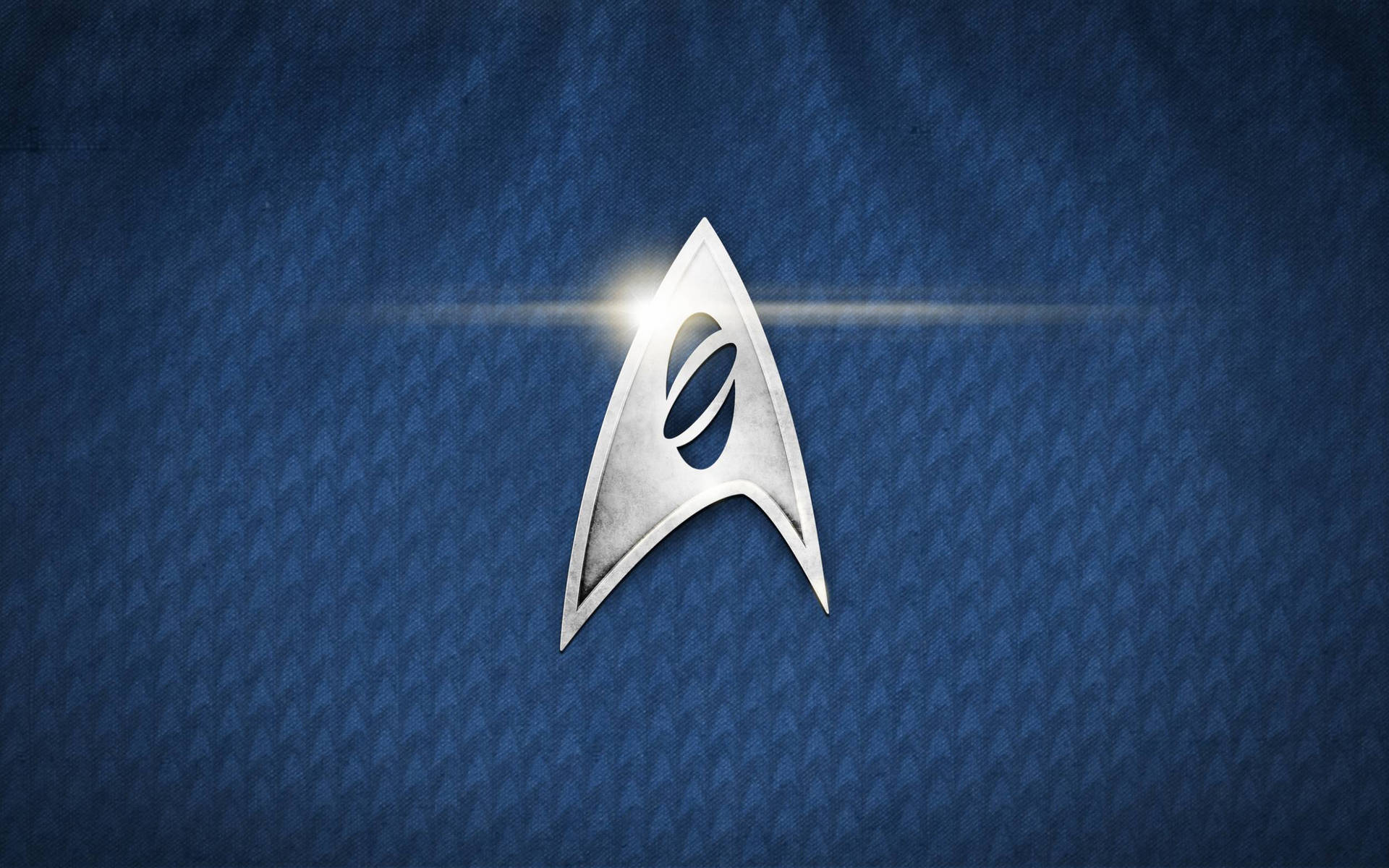 Uniting The Galaxy With The Iconic Star Trek Logo Wallpaper