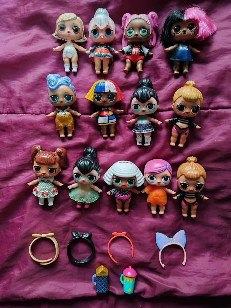 A Bunch Of Lol Surprise Dolls And Accessories