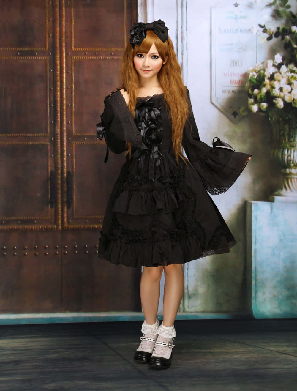 Elegant Lolita Fashionista Posing Gracefully Wallpaper
