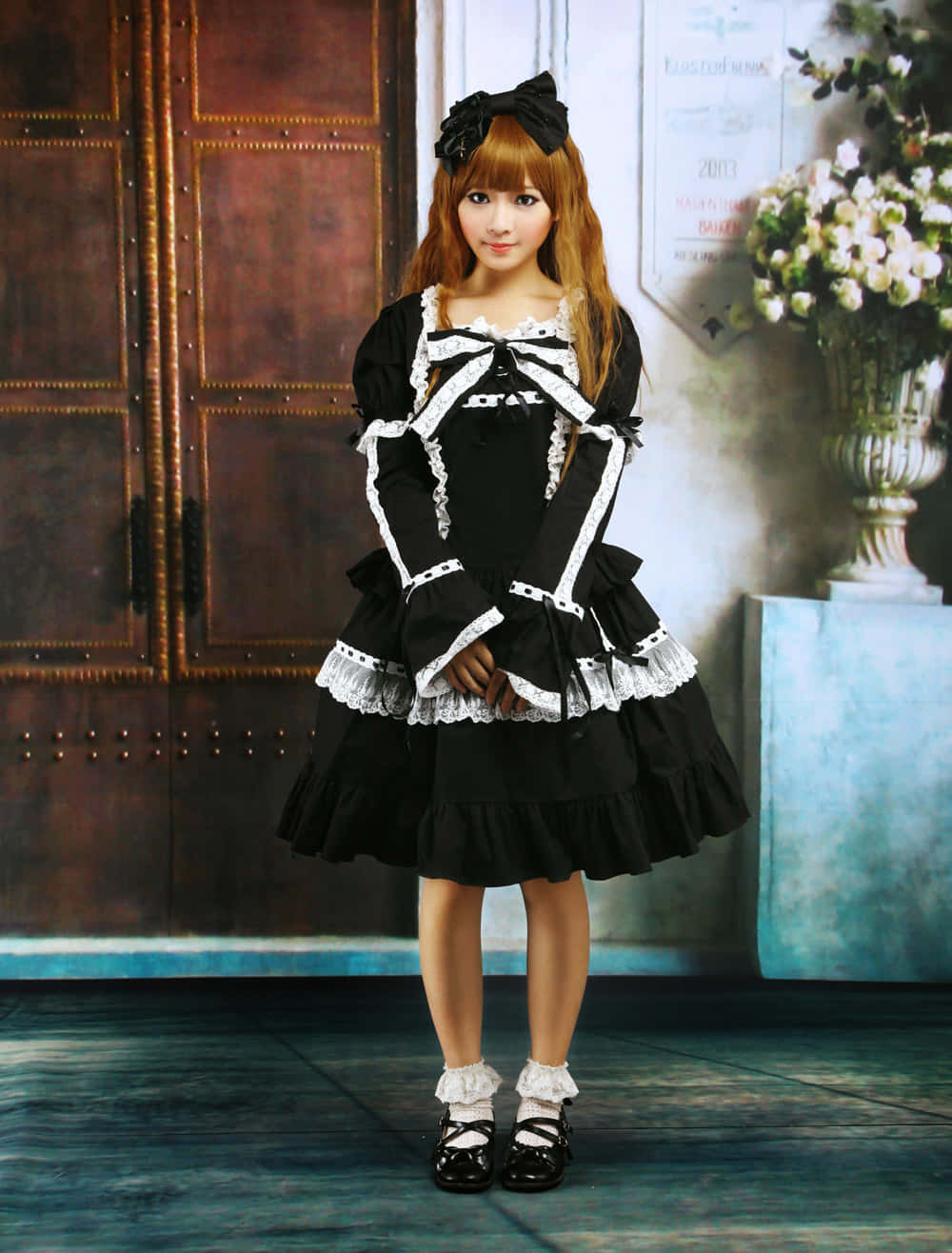 Elegant young lady dressed in classic Lolita Fashion Wallpaper