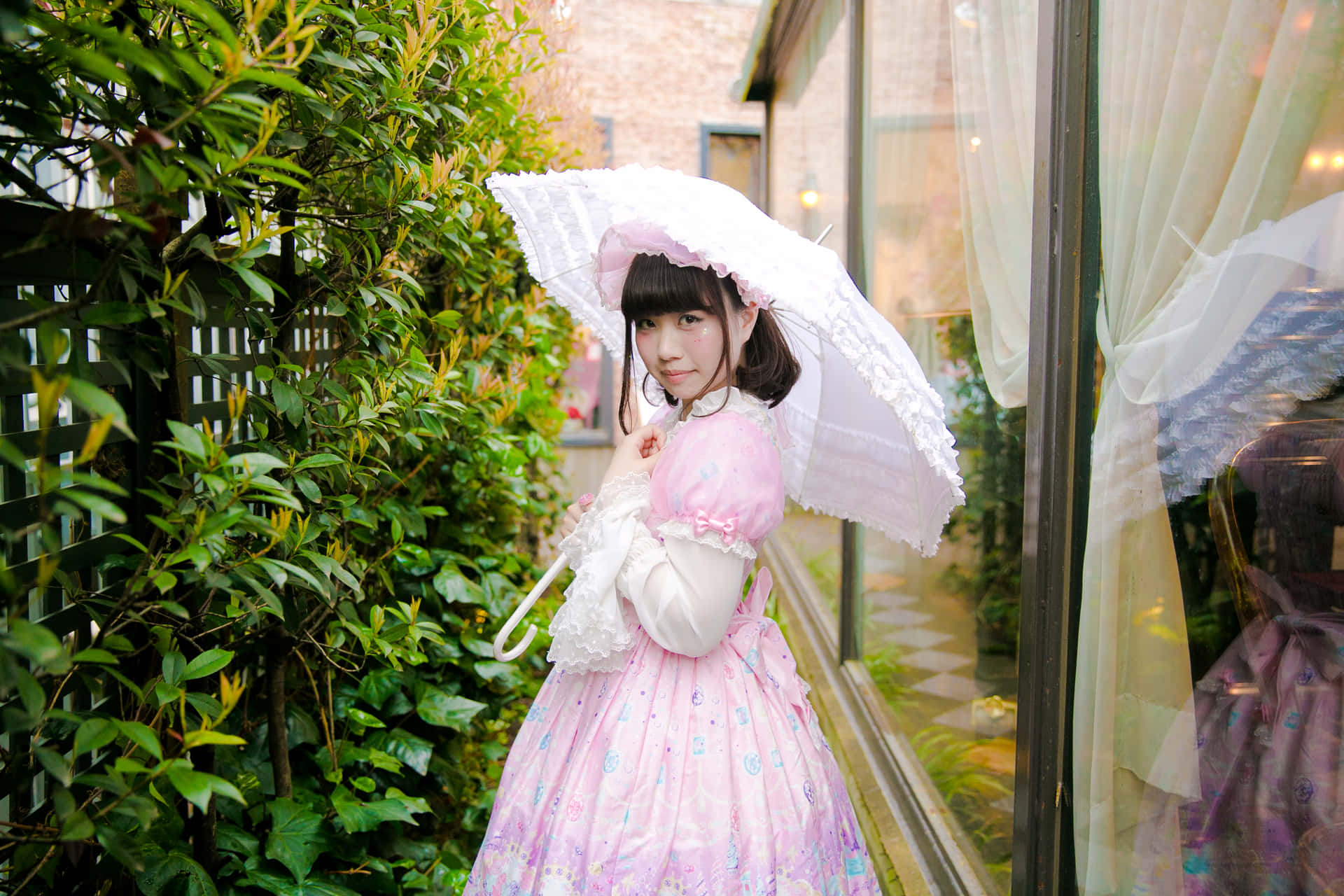 Elegant Lolita Fashionista Posing Outdoors Wallpaper