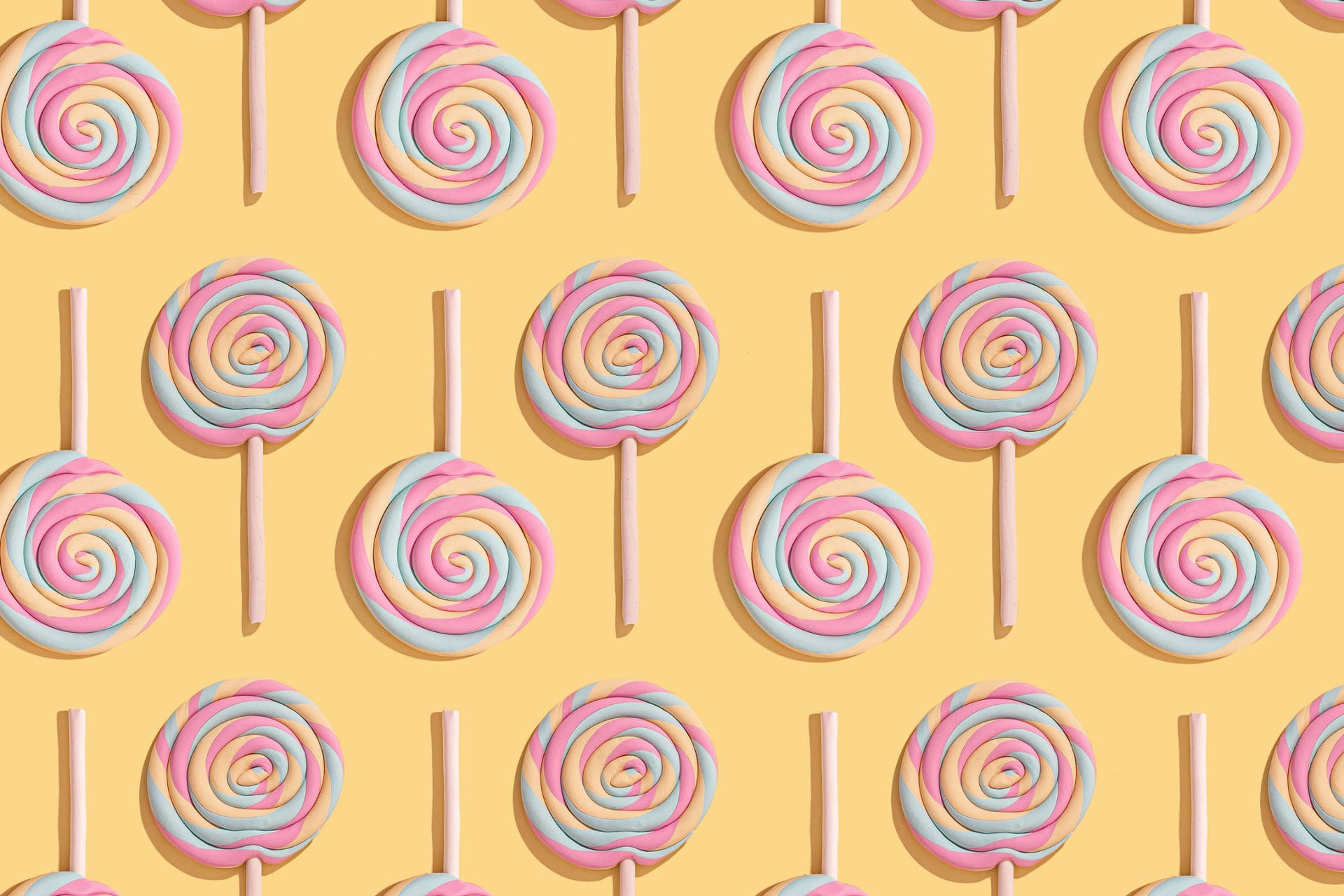 Vibrant Lollipop Candies Pattern Wallpaper