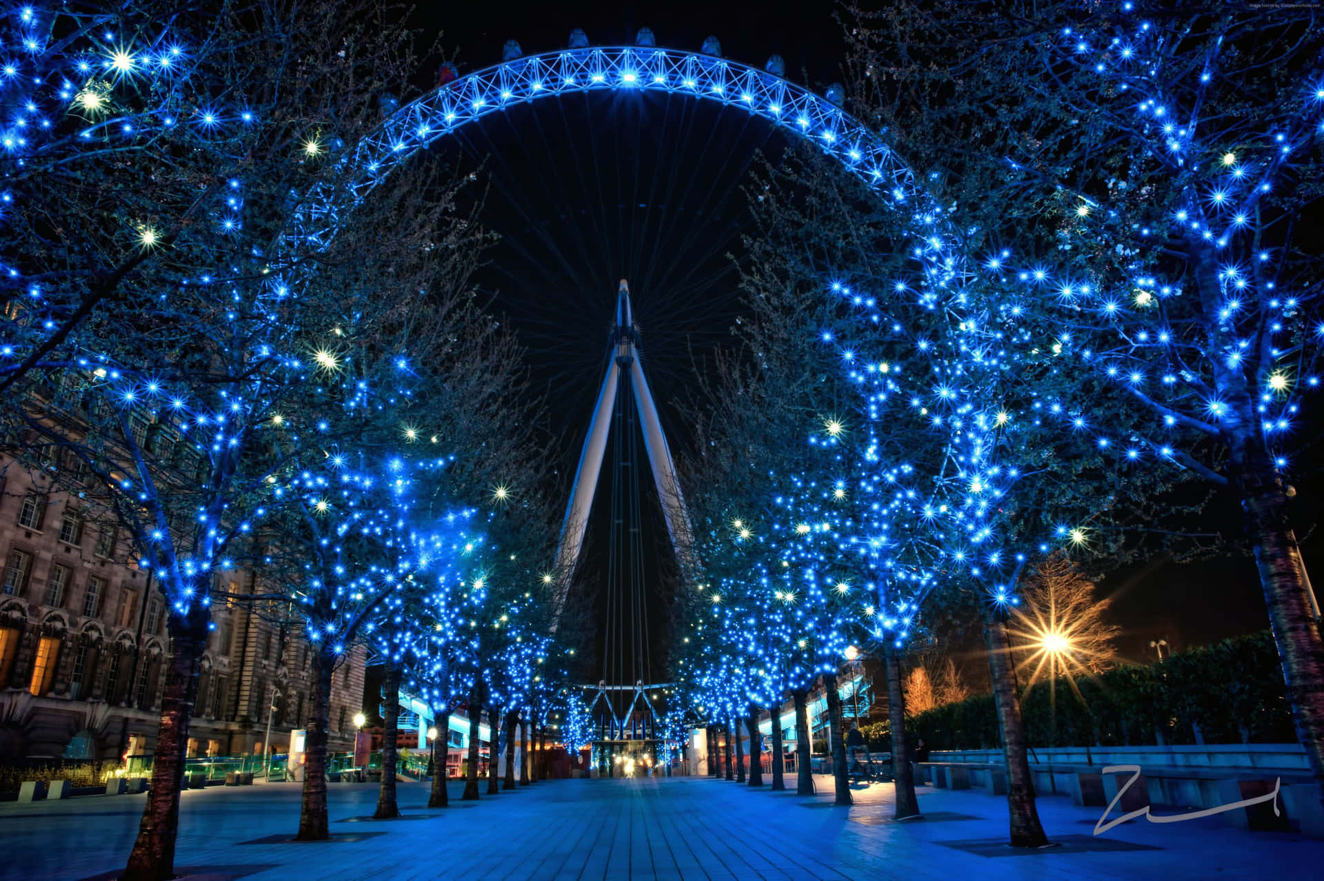 London Eye With Blue Lights For Christmas Season Wallpaper