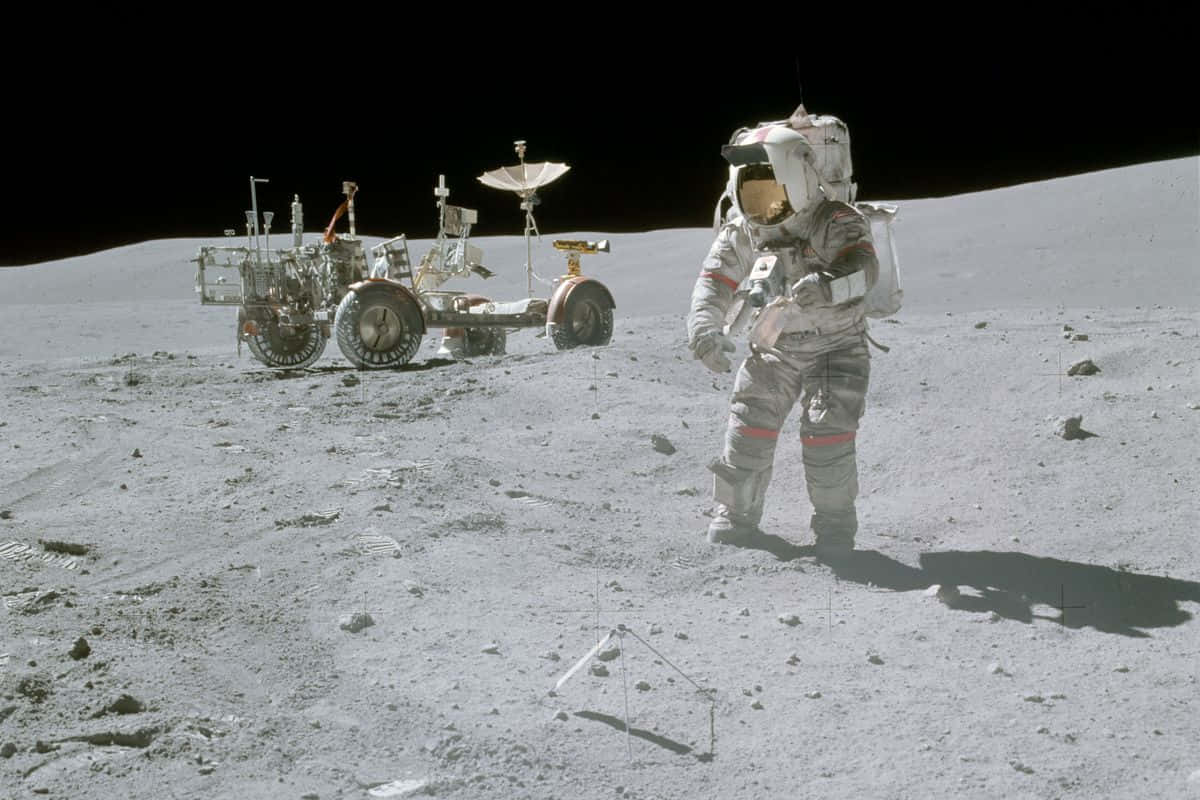 Lone Astronaut Exploring Lunar Surface Wallpaper