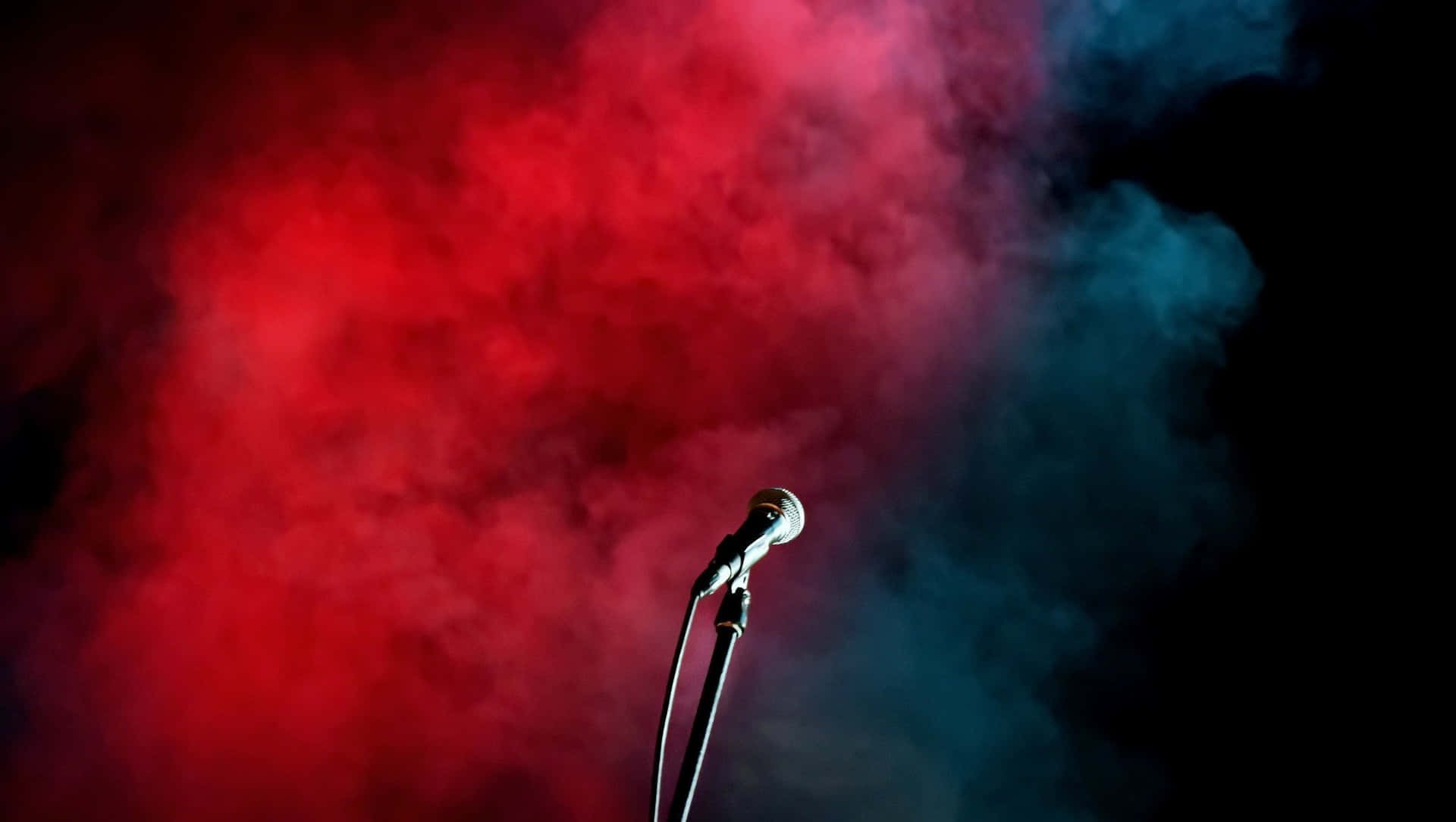 Lone Microphone In Red And Blue Smoke Wallpaper