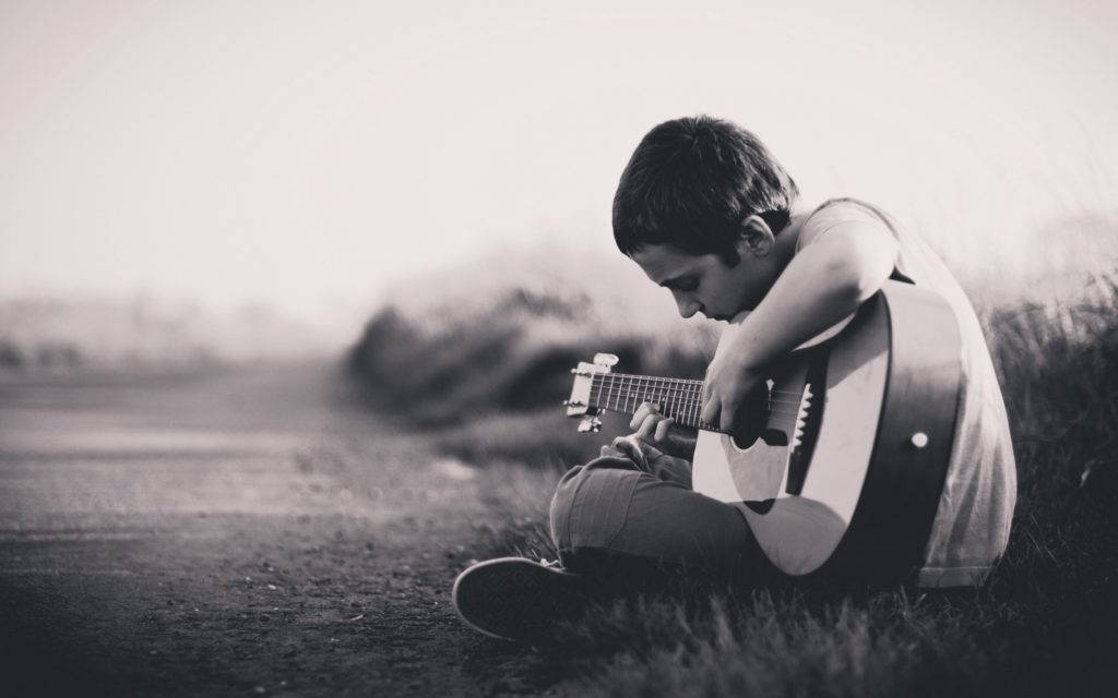 Lonely Boy Playing The Guitar Wallpaper