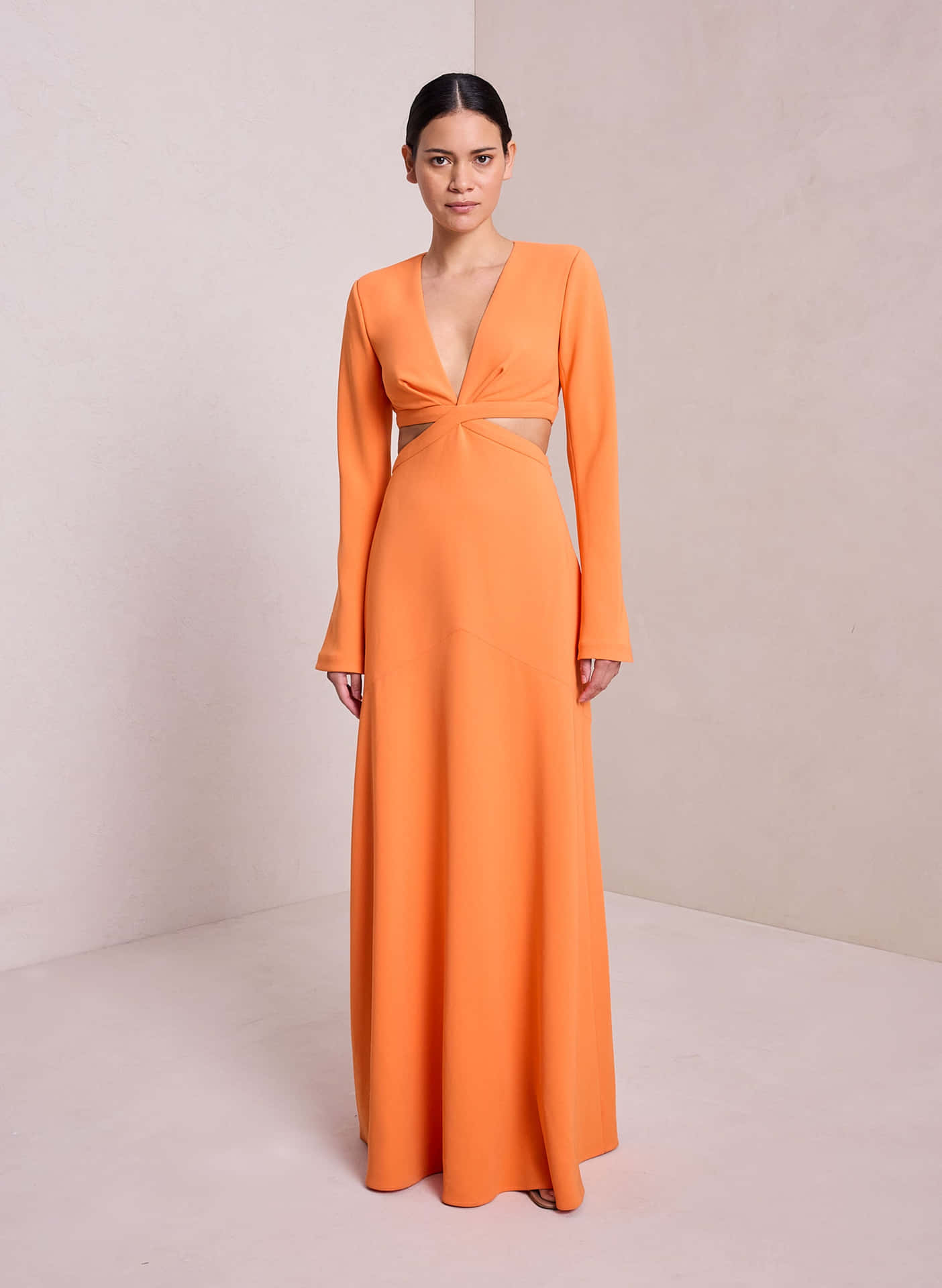 Model In An Orange Butterfly Sleeved Long Dress Picture