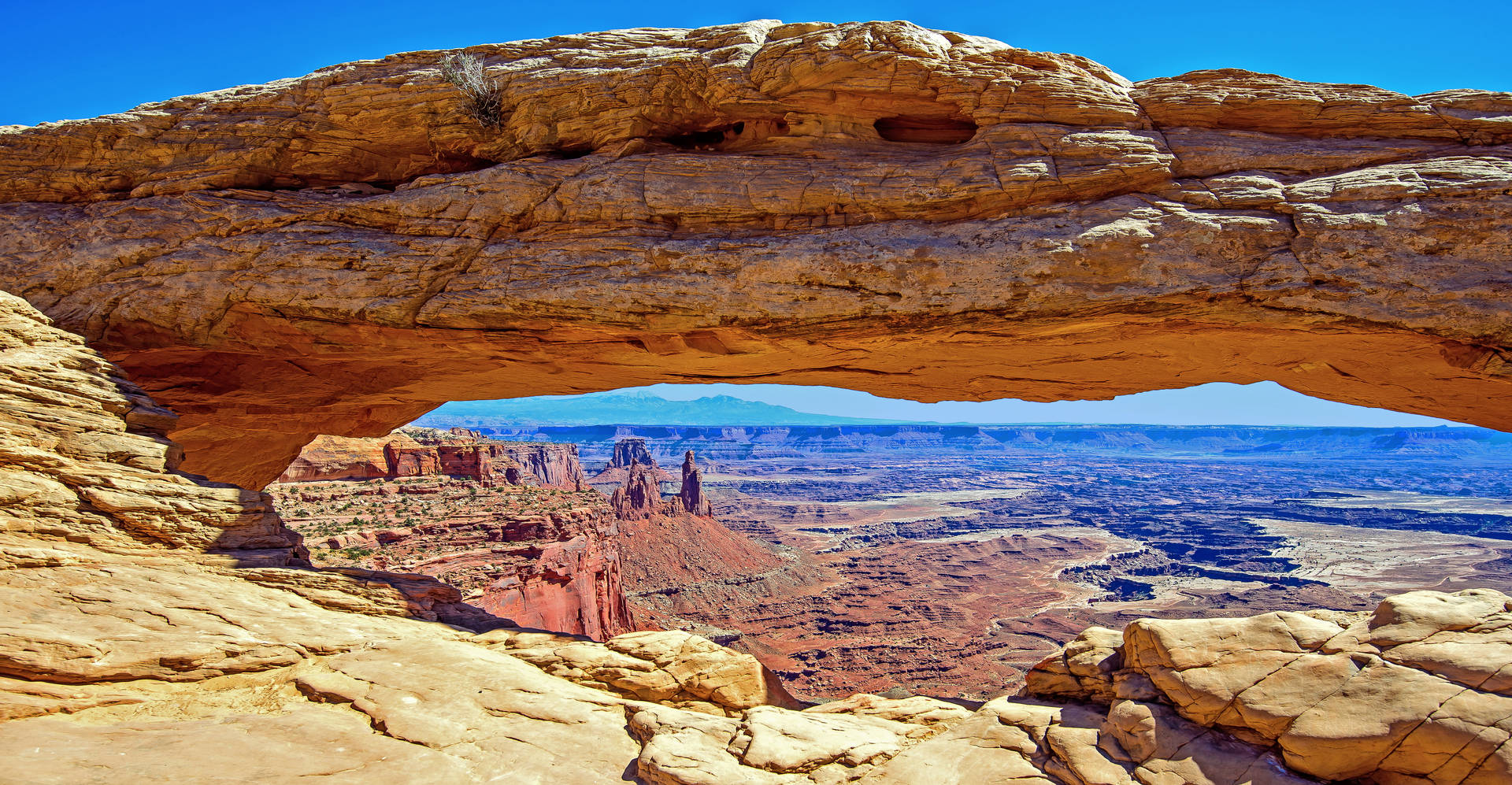 Caption: Majestic Long Rock Formation in Canyonlands National Park Wallpaper