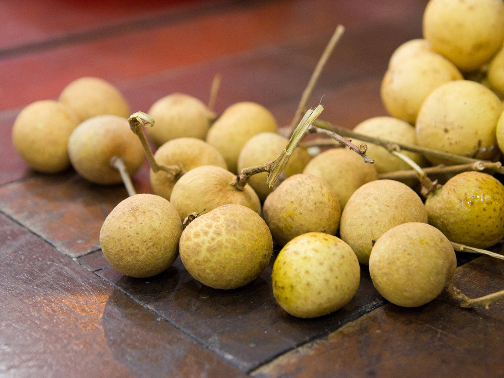Longan Fruits Scattered On The Table Background
