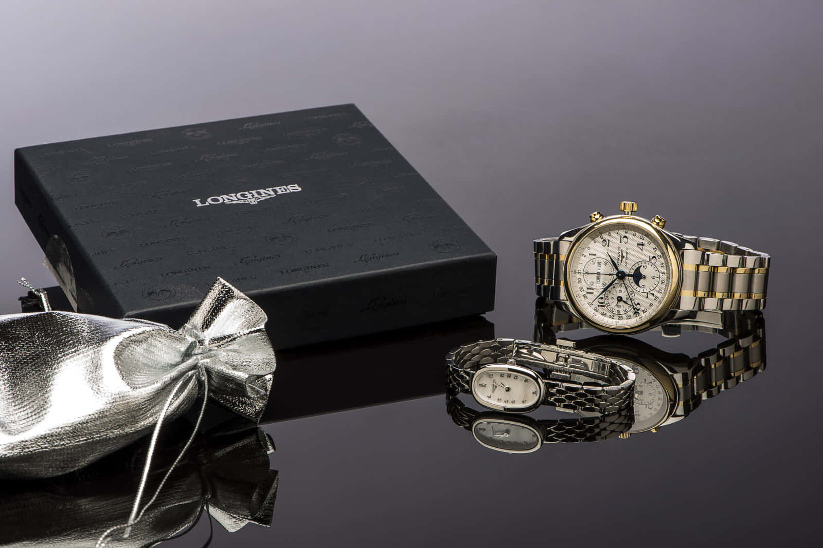 Affectionate Couple Showcasing Luxurious Longines Watches Wallpaper