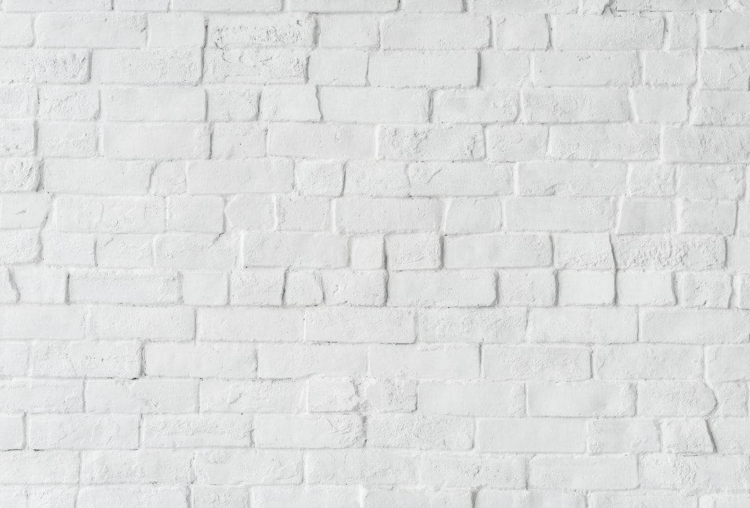 Stand Out From the Crowd with a Lopsided White Brick Wallpaper