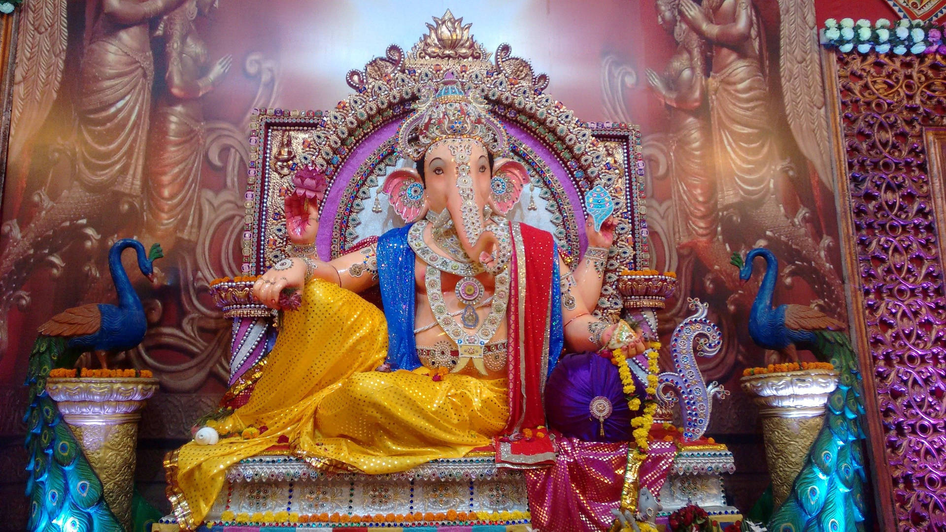 Caption: Divine Lord Ganesha On Bejeweled Throne Desktop Wallpaper Wallpaper
