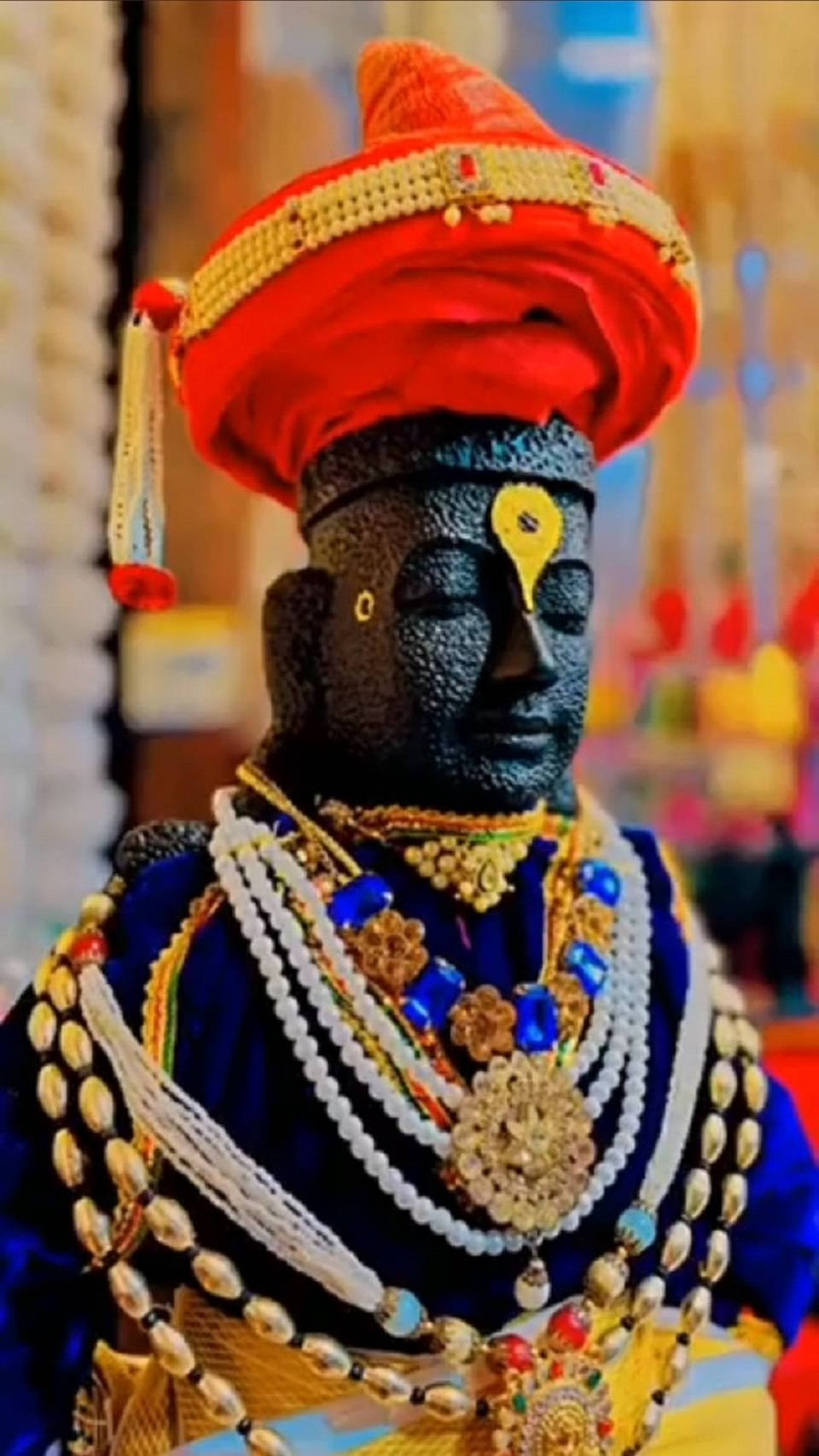 Lord Pandurang Stone Statue In Blue Garment Wallpaper