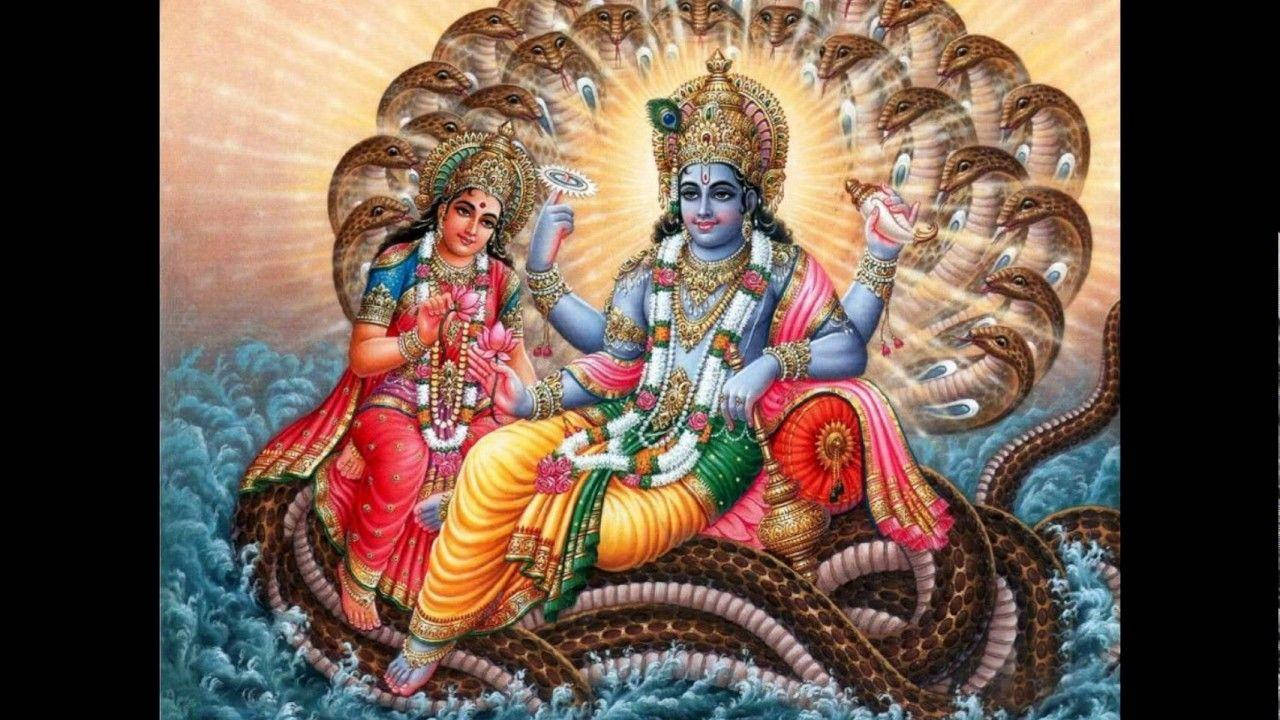 Majestic portrayal of Lord Vishnu with Goddess Lakshmi Wallpaper