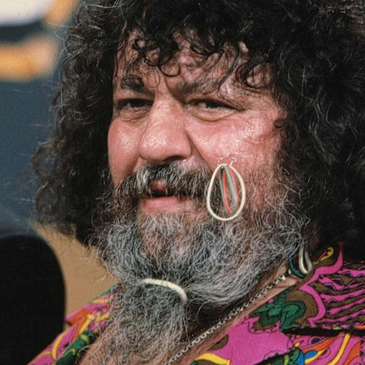 Lou Albano With Rubber Bands On His Cheek Wallpaper