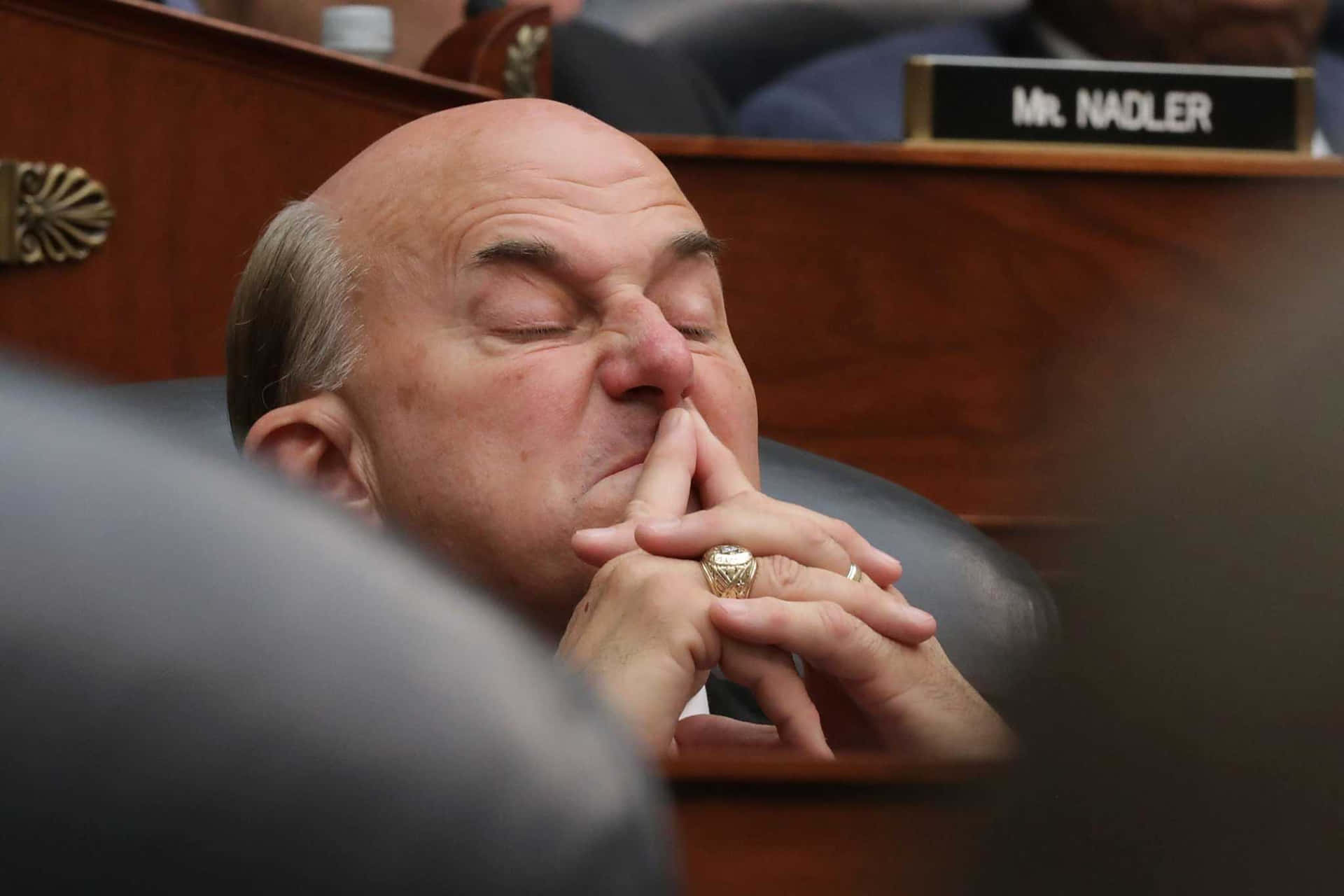 Caption: Congressman Louie Gohmert Scrunching His Nose Wallpaper