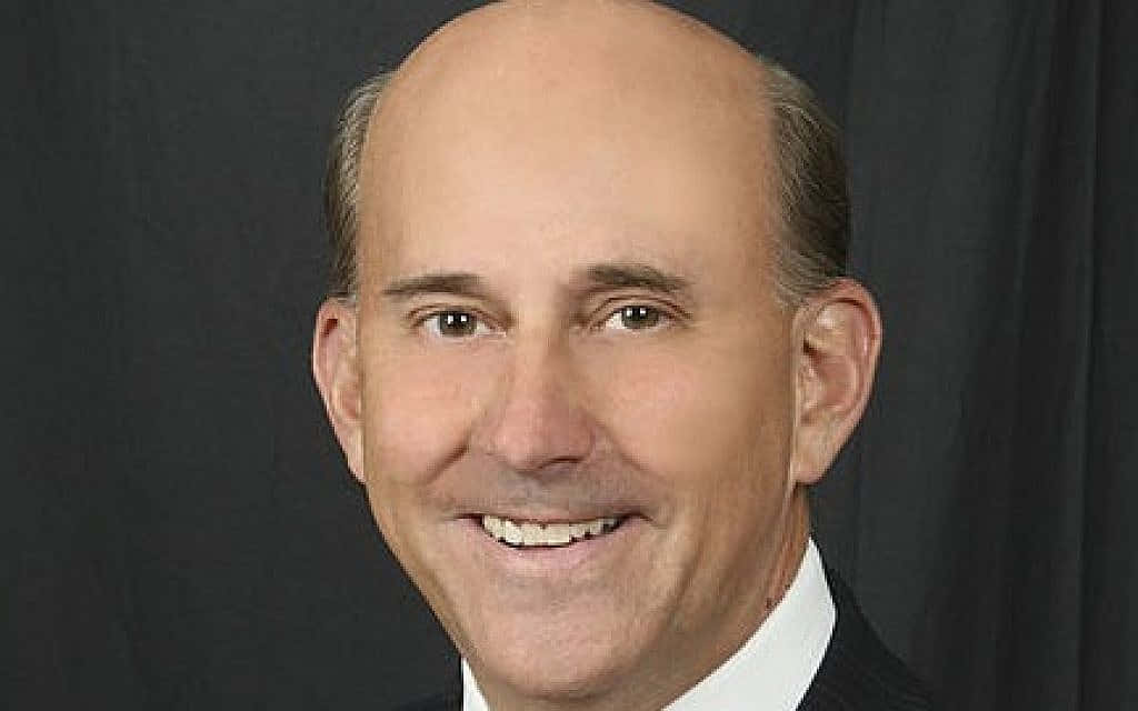 A confident Louie Gohmert smiling at the camera Wallpaper