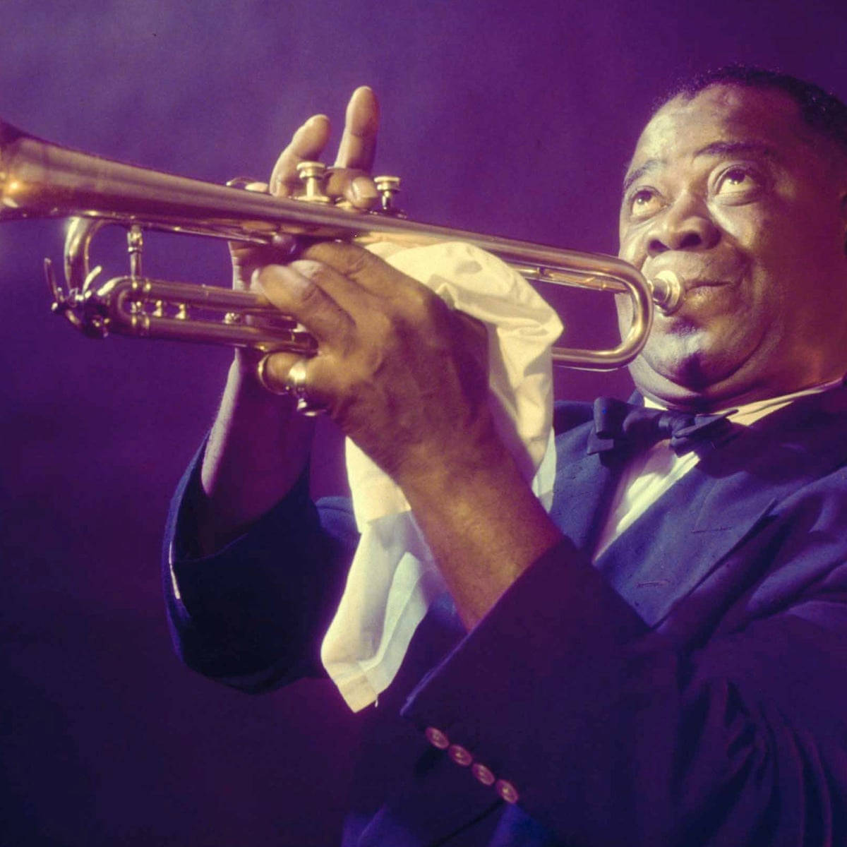 Legendary Jazz Maestro Louis Armstrong in Action Wallpaper