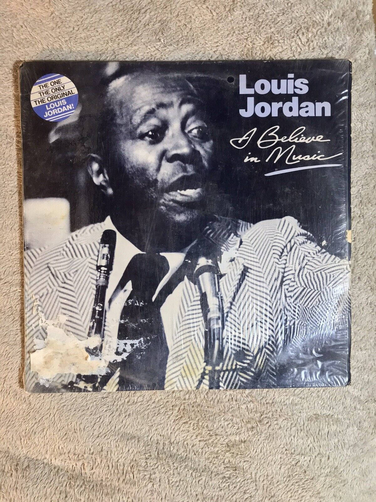 Iconic Louis Jordan 'I Believe in Music' Vinyl Record. Wallpaper