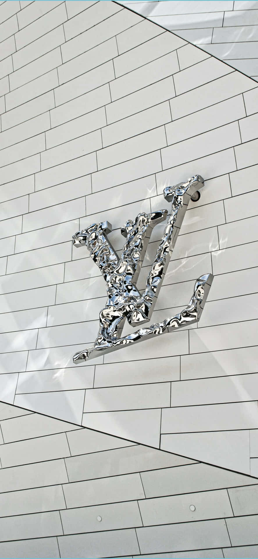Oplev luksusen fra Louis Vuitton med dette spektakulære 4K-tapet. Wallpaper