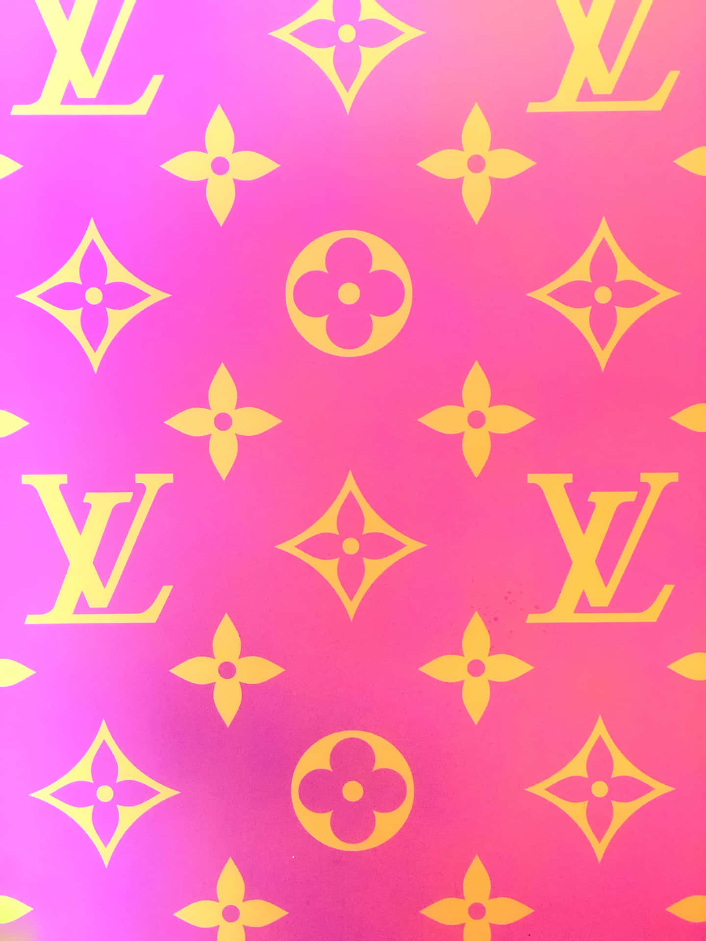 Download A pink Louis Vuitton purse adding a pop of color to an outfit.  Wallpaper