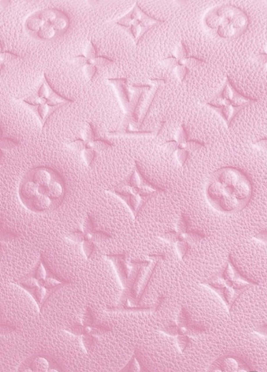 Download A pink Louis Vuitton purse adding a pop of color to an outfit.  Wallpaper