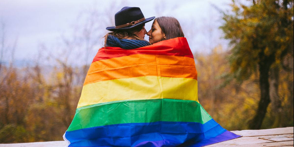 Love Is Love Couple With Pride Flag Wallpaper