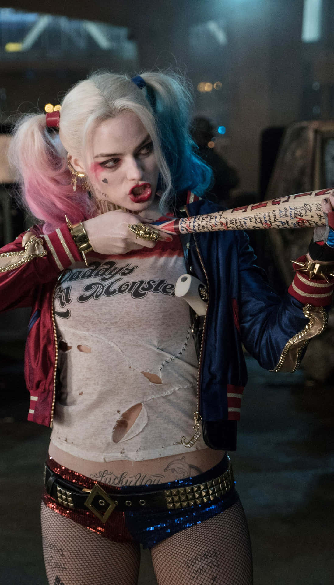 harley quinn in a costume holding a bat Wallpaper