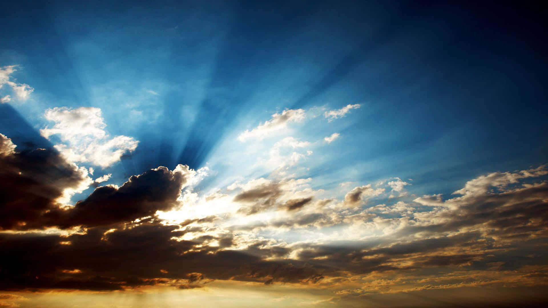 Lovely Clouds With Sun Rays Wallpaper