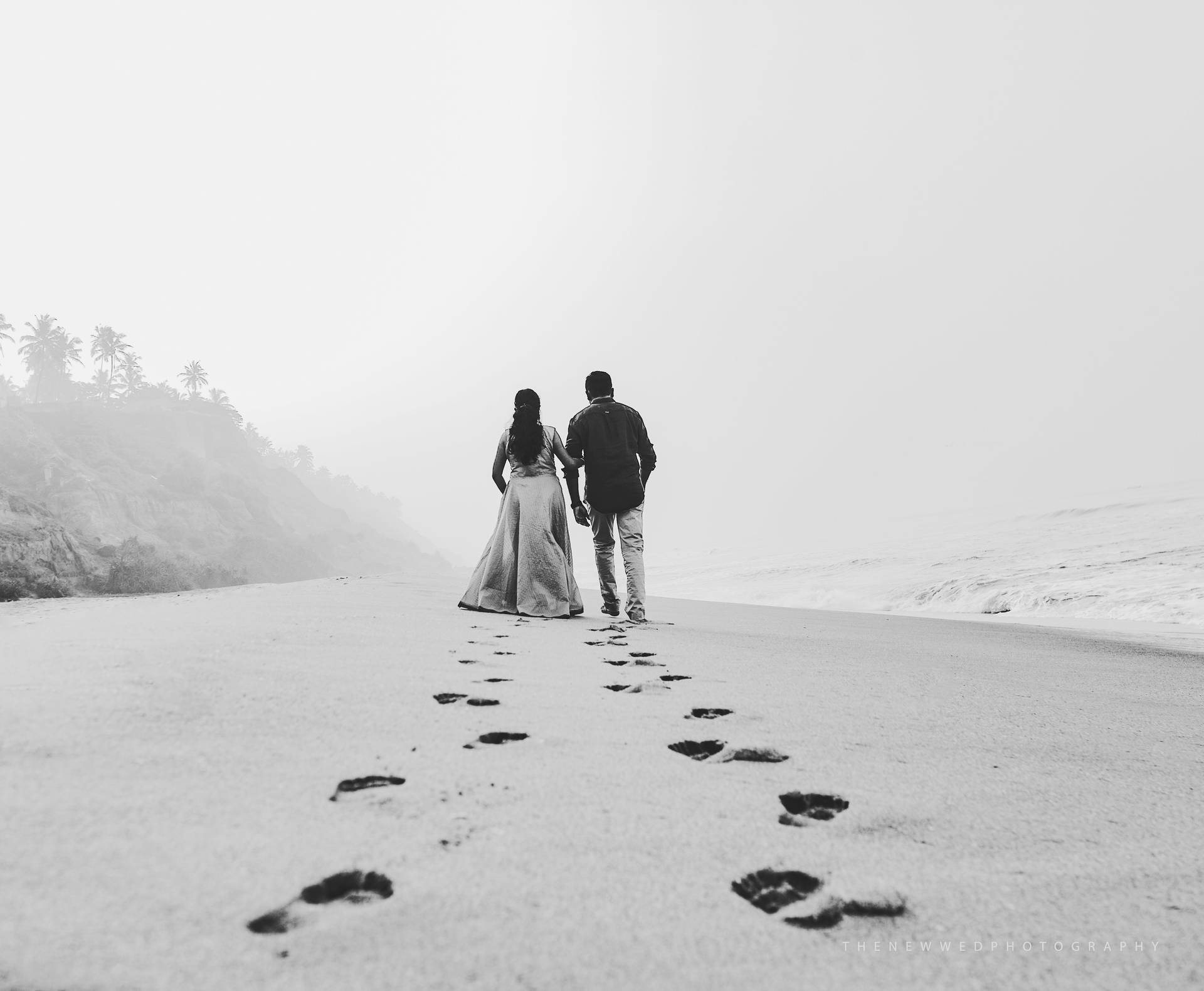 Lovers Footprints On The Sand Wallpaper