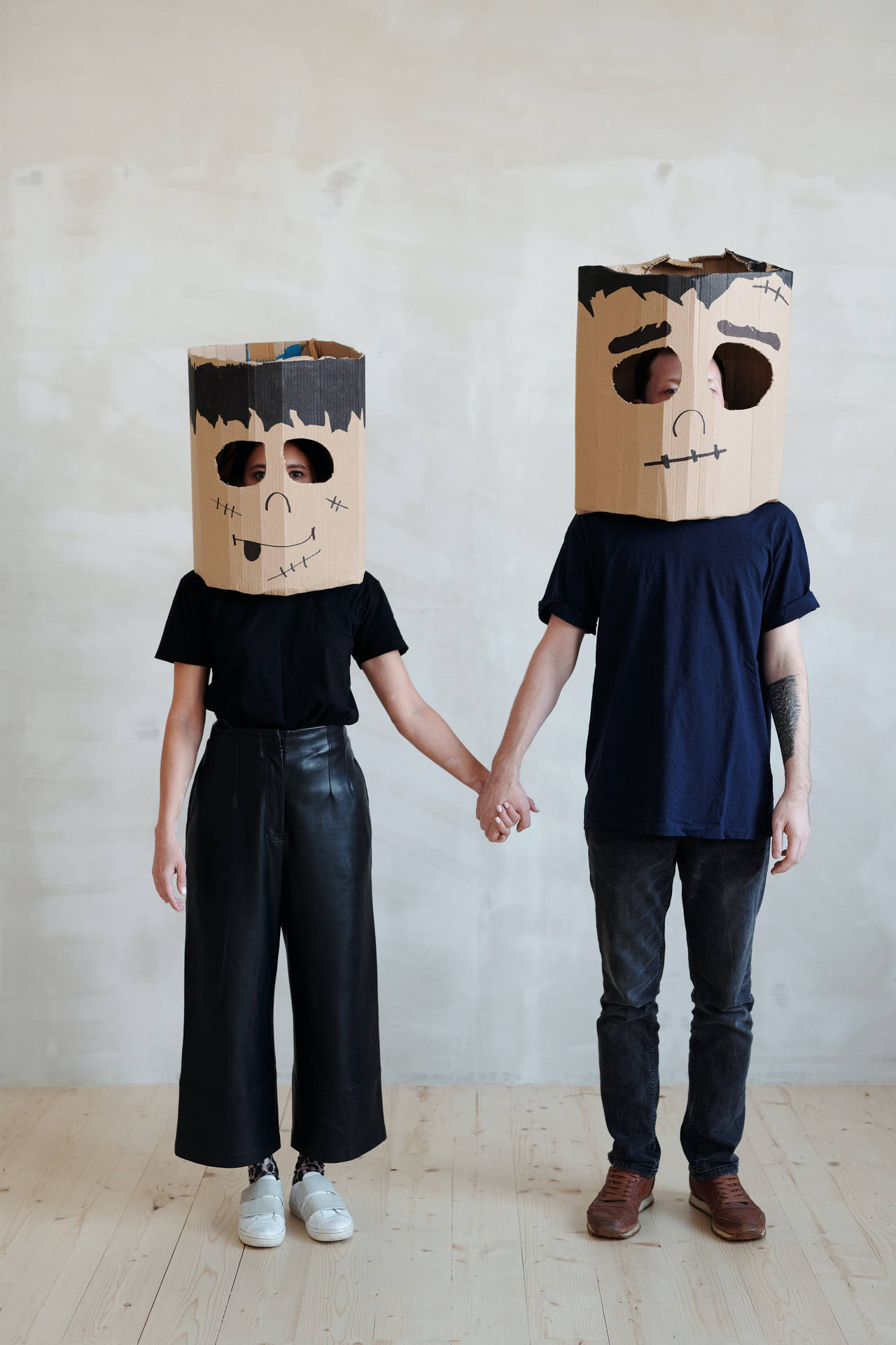 Lovers In Cardboard Masks Wallpaper