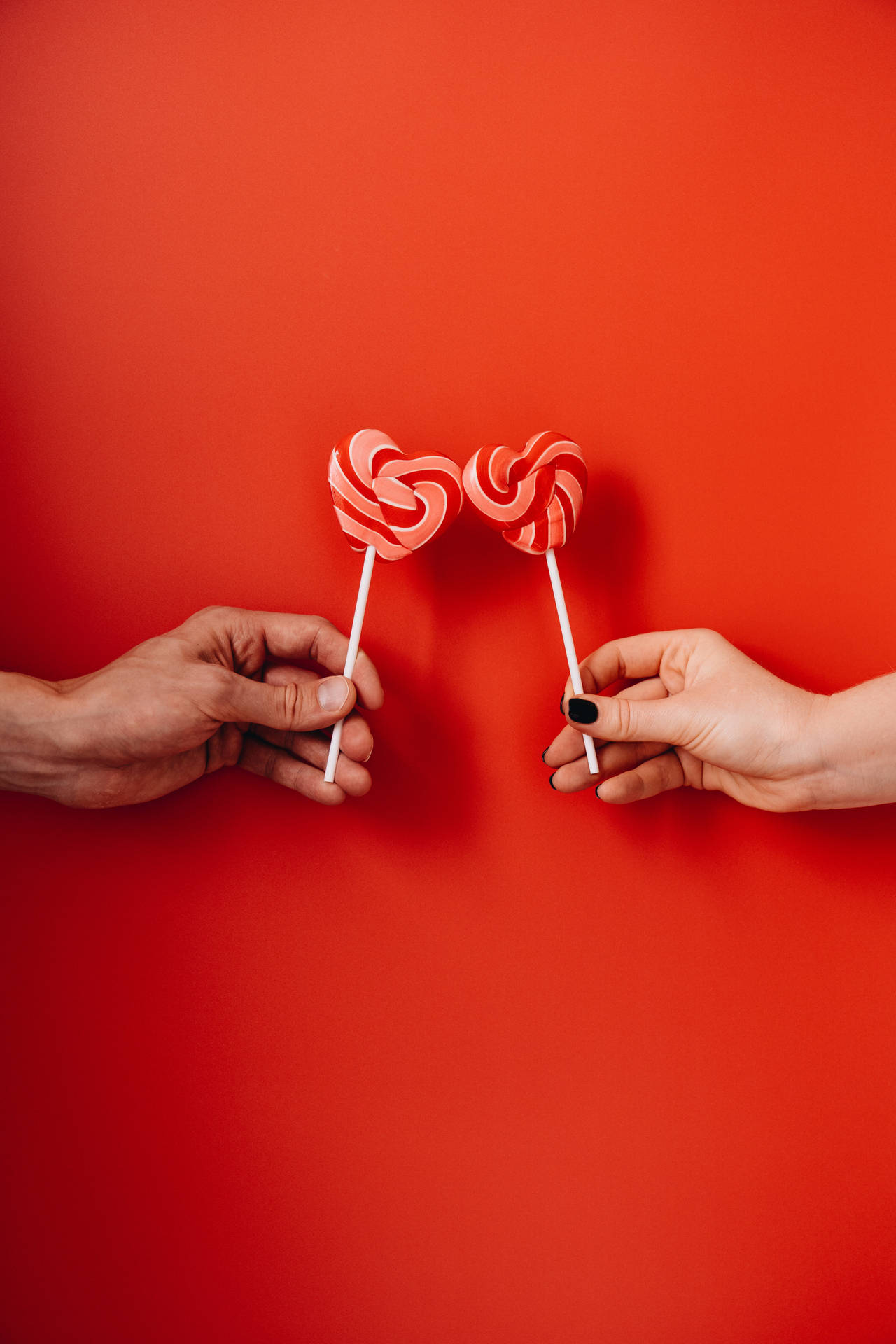 Lovers With Heart-Shaped Lollipops Wallpaper
