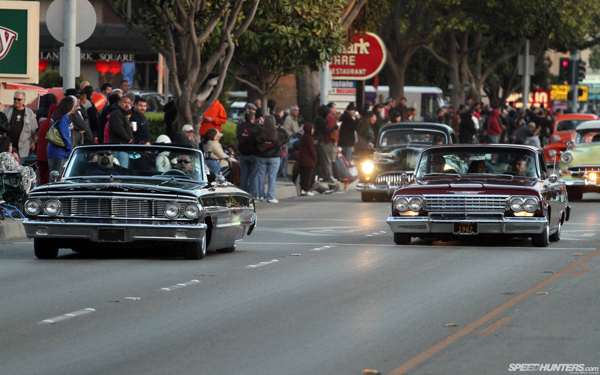 Lowrider Enthusiasts Driving Show Wallpaper