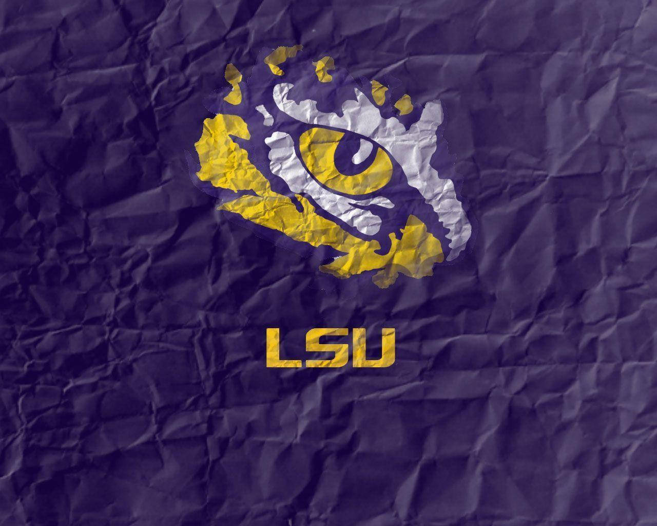 The LSU Tigers celebrating a victory on the field Wallpaper