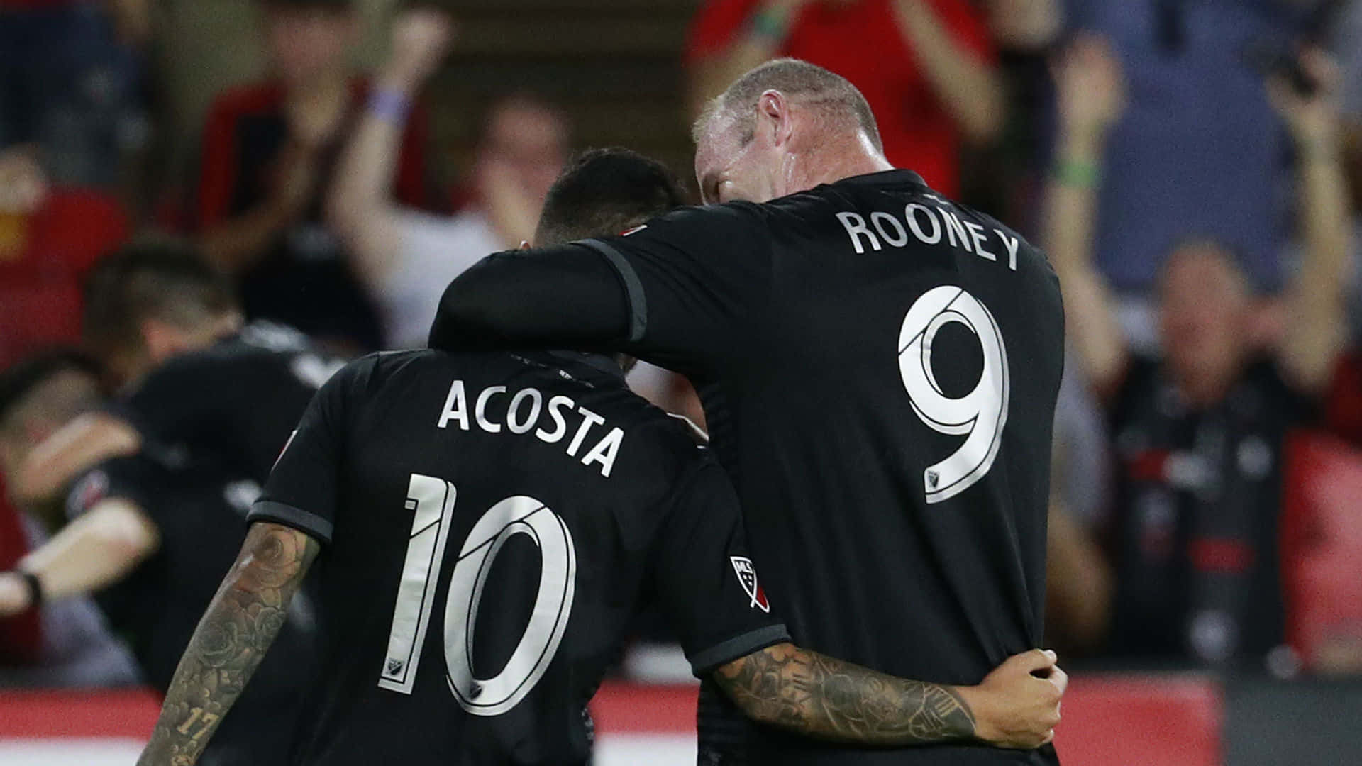 Luciano Acosta And Team Captain Rooney Picture