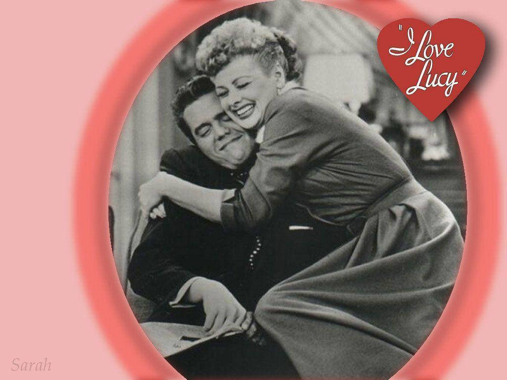 TV icons Lucille Ball and Desi Arnaz share a loving embrace Wallpaper