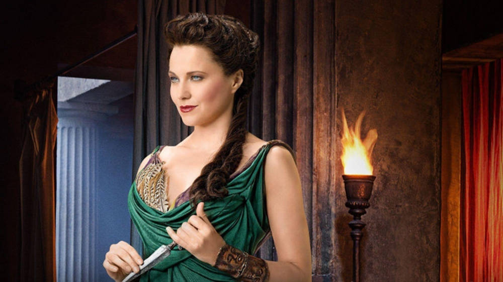 Download Lucy Lawless In Green Dress Wallpaper | Wallpapers.com