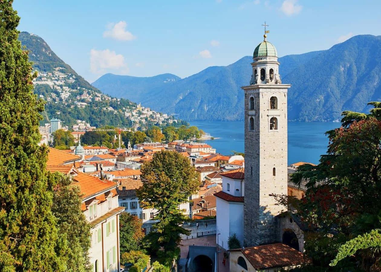 Lugano Lake Viewwith Bell Tower Wallpaper