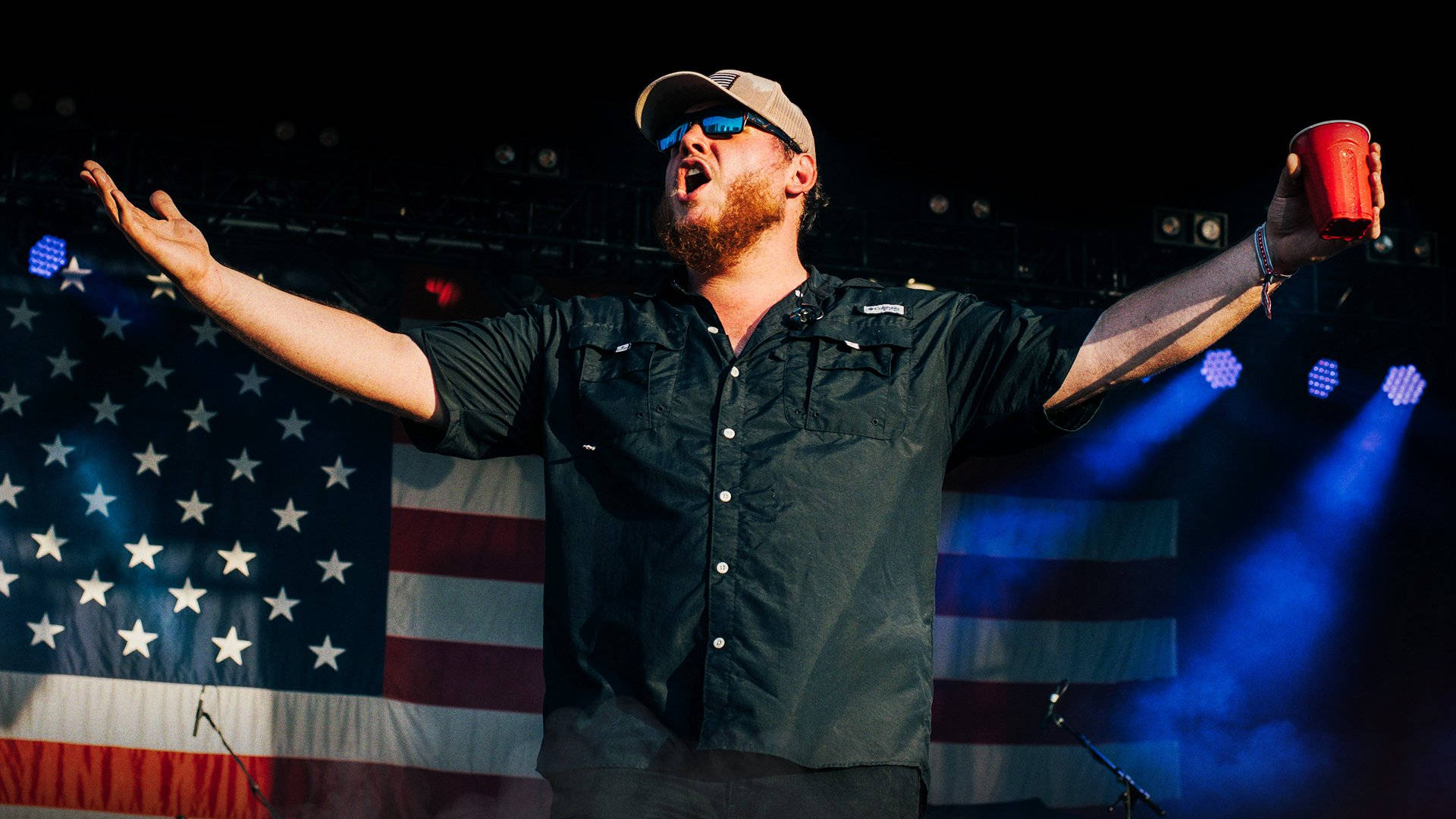"Country music singer-songwriter Luke Combs performing on stage" Wallpaper