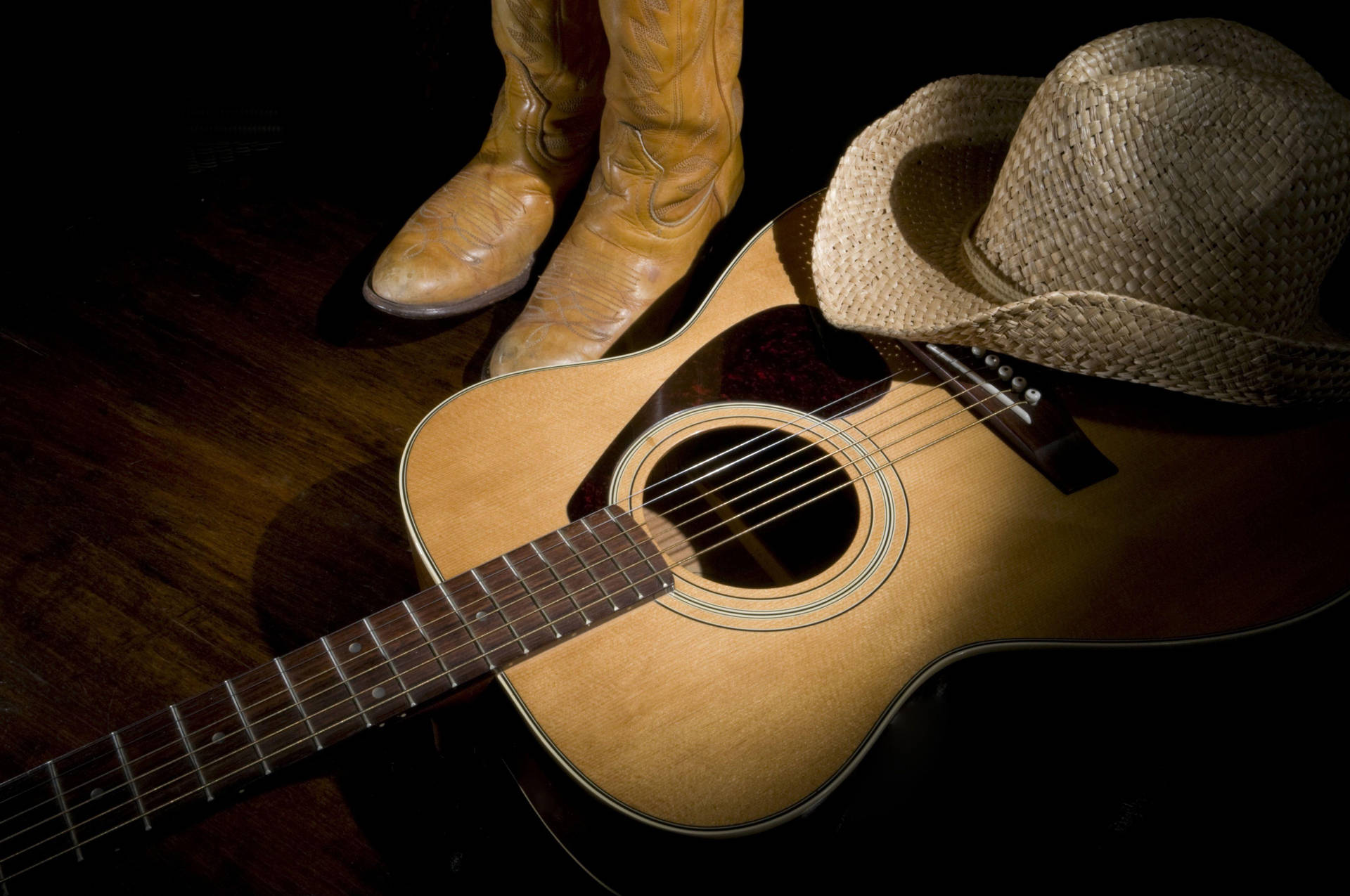 A Cowboy Hat And Cowboy Boots Wallpaper